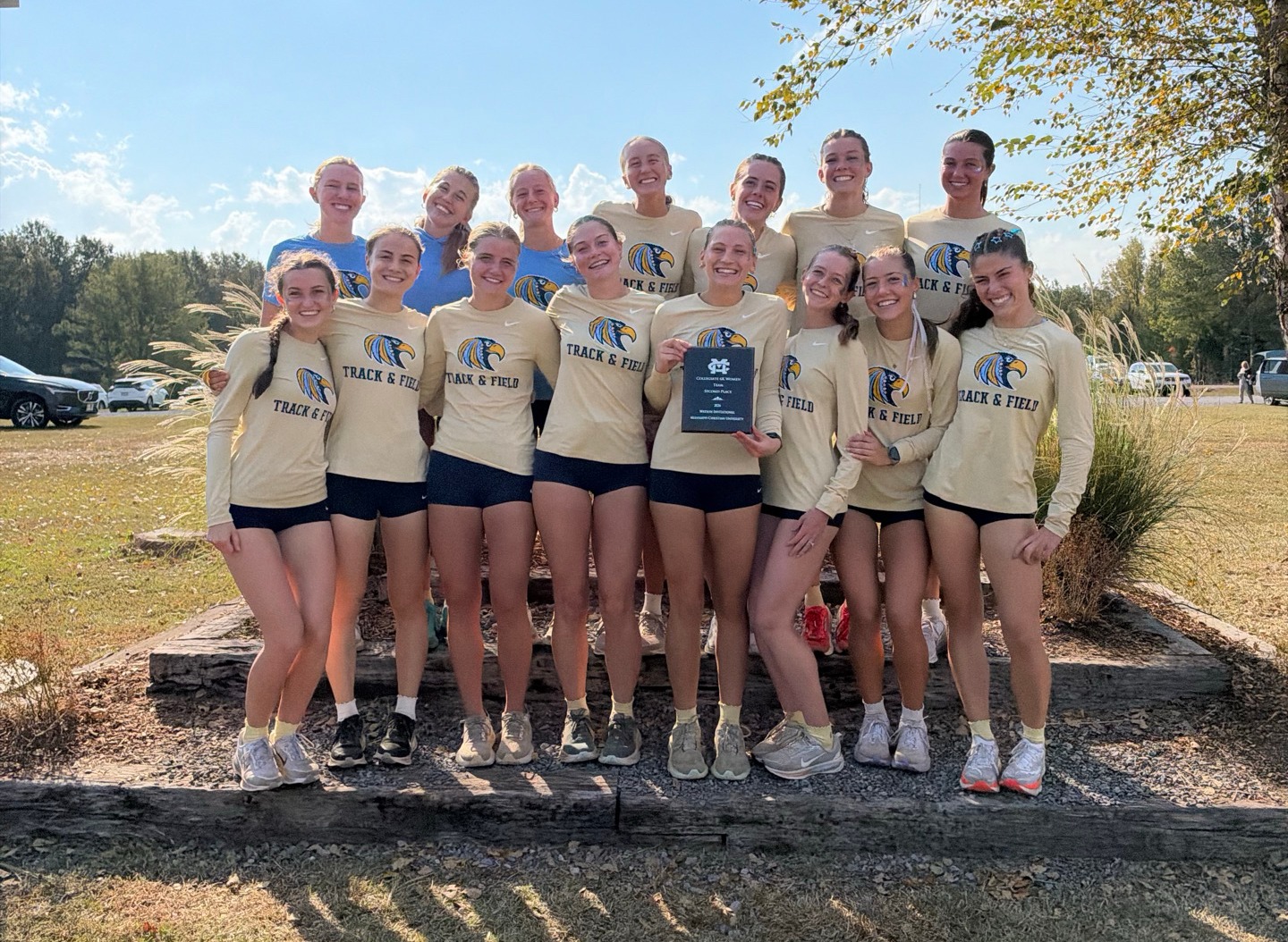 Women's XC team receiving awards at Watson Invitational