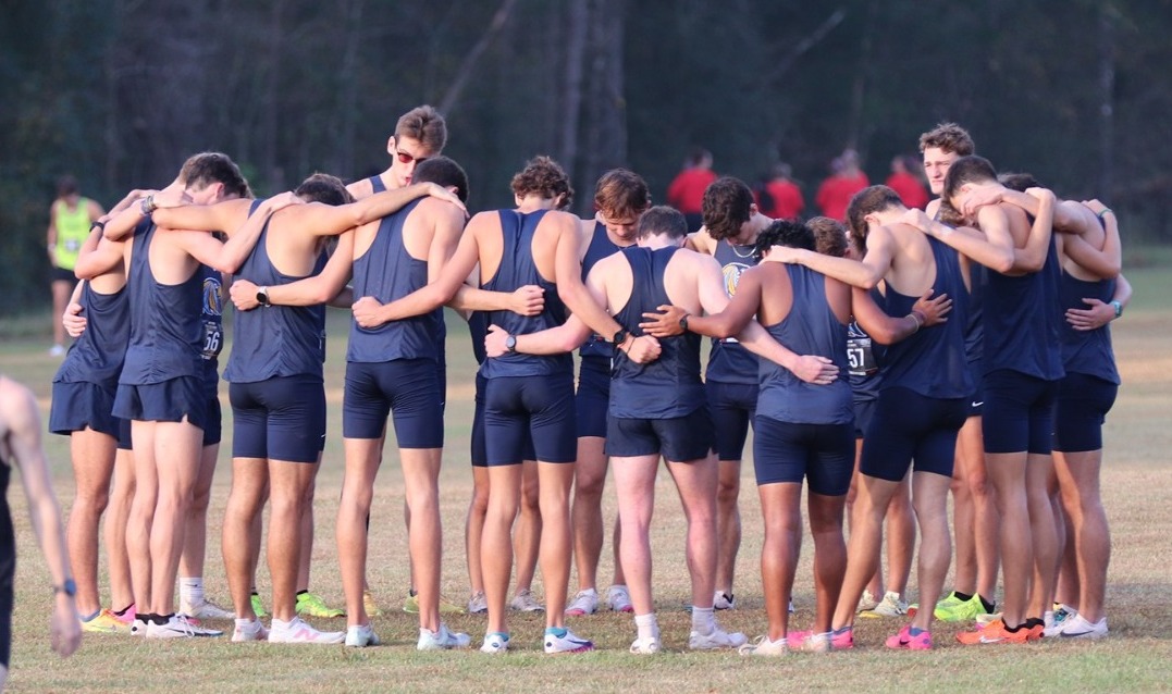 Choctaw men huddle before Watson Invitational