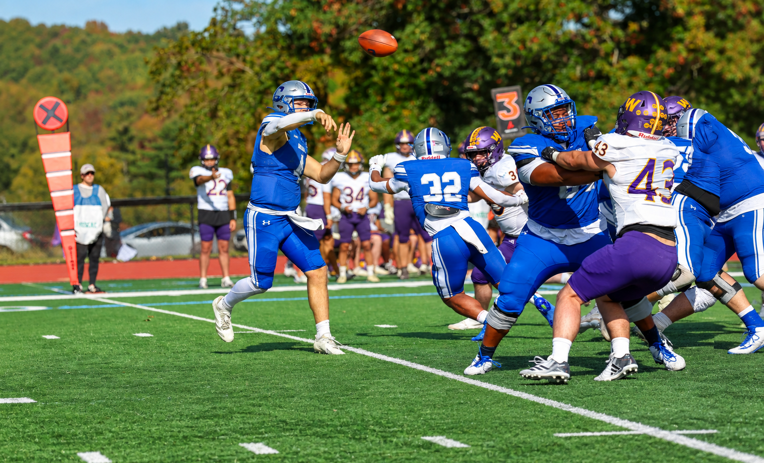 Colby quarterback Stephen Gill stands in the pocket 