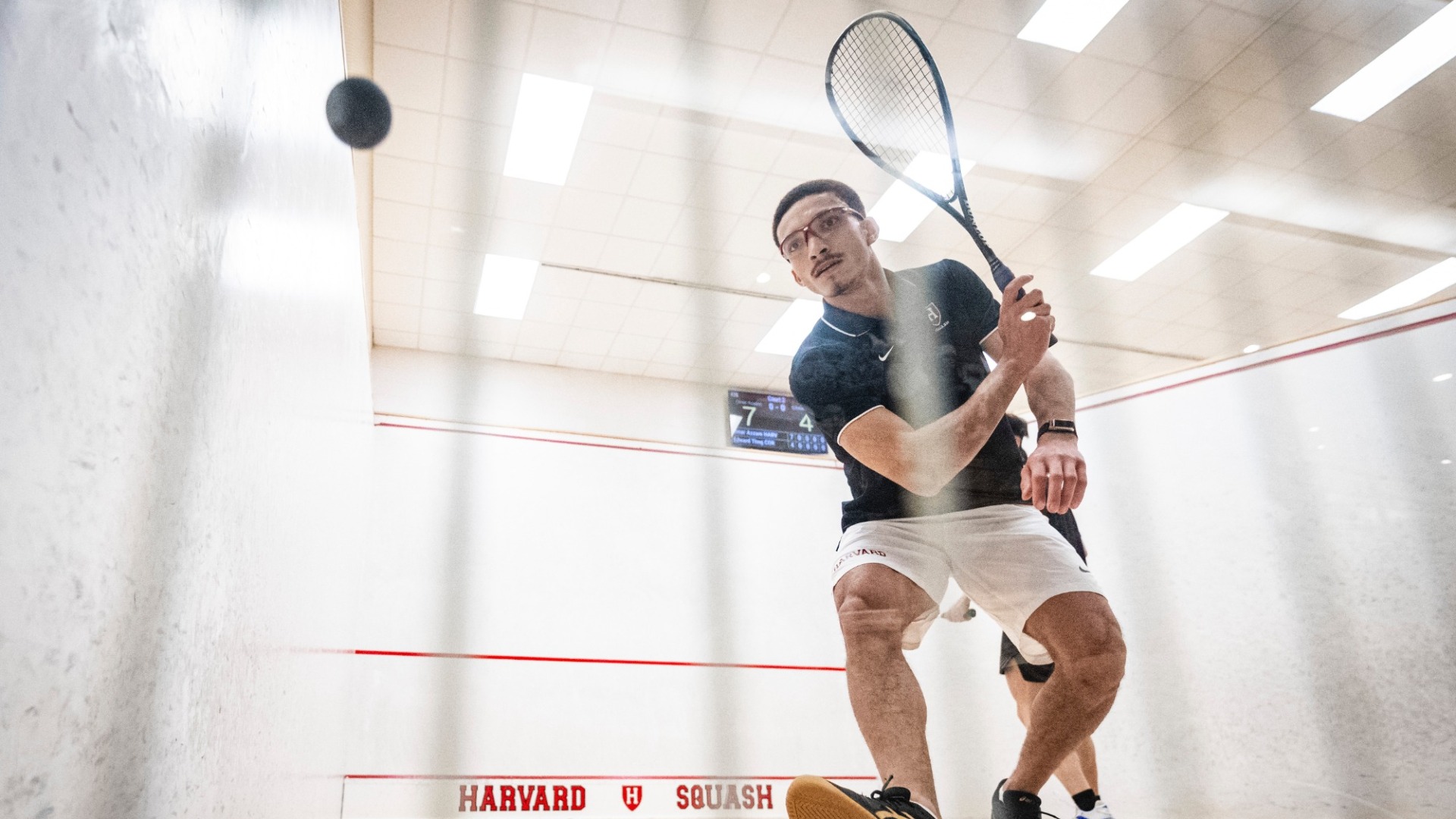 Omar Azzam returning a shot