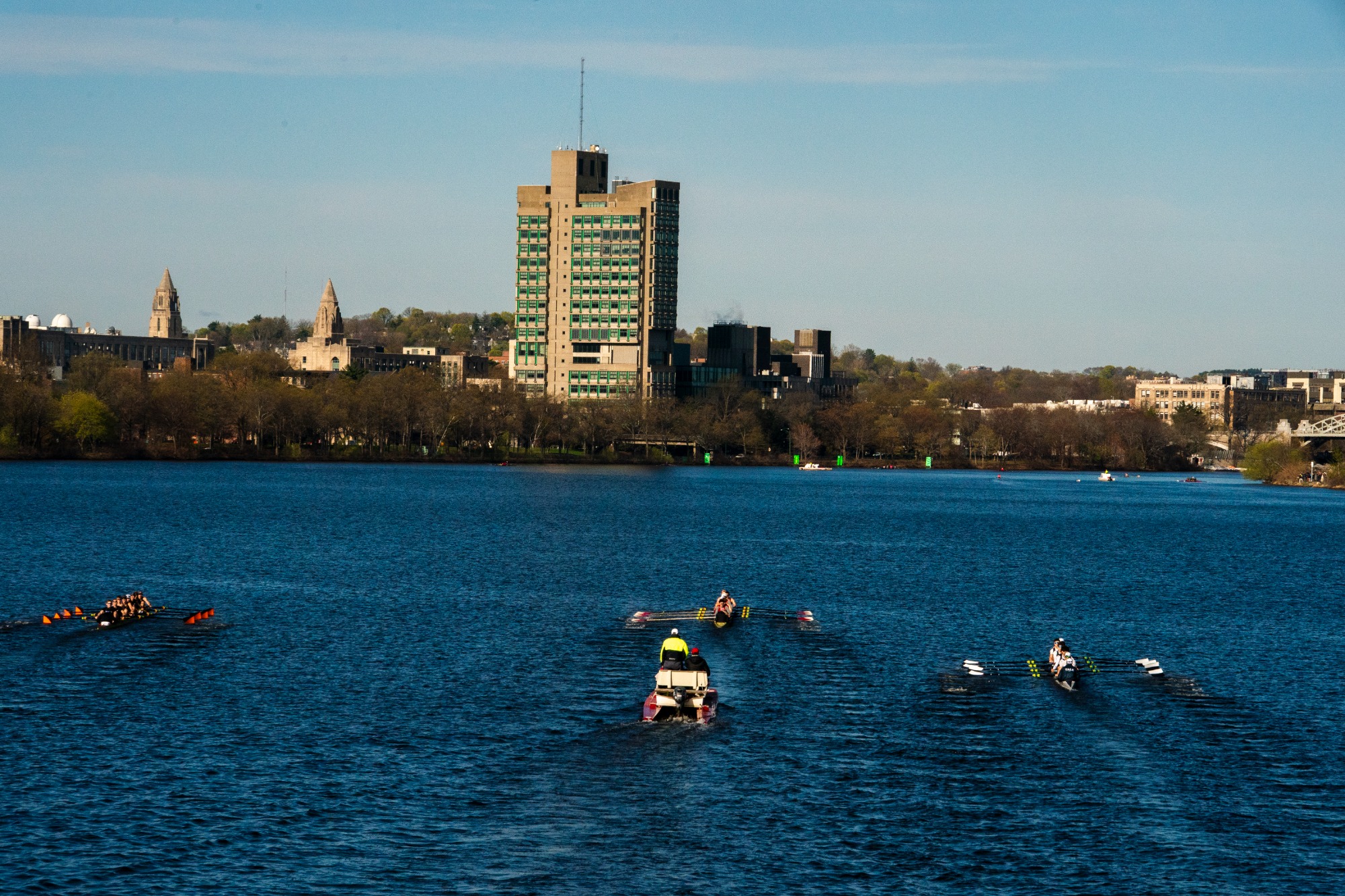 Second varsity eight rows against Princeton and Yale on the Charles River.
