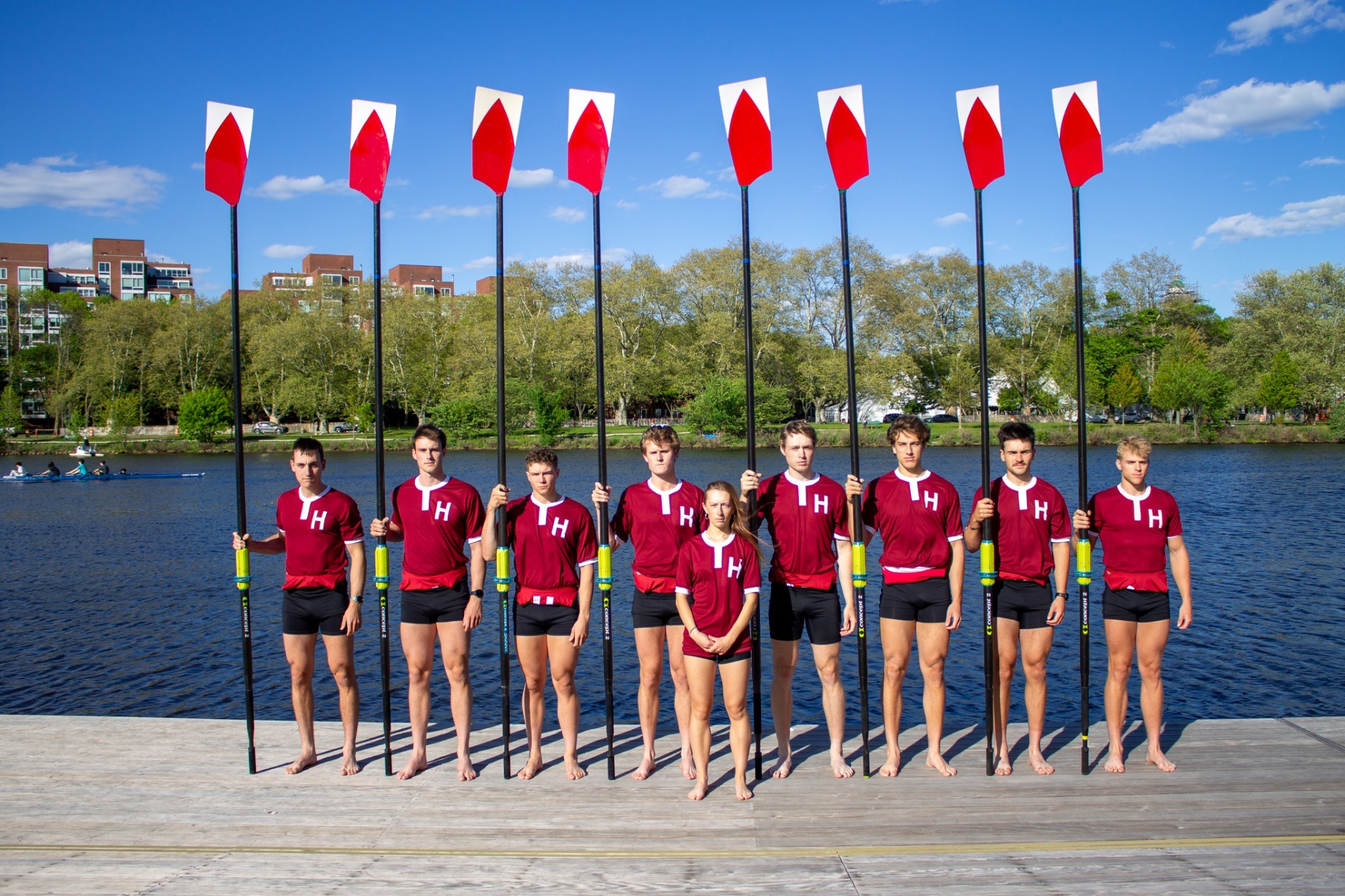 Varsity eight pose for boat photo prior to Harvard-Yale Regatta.