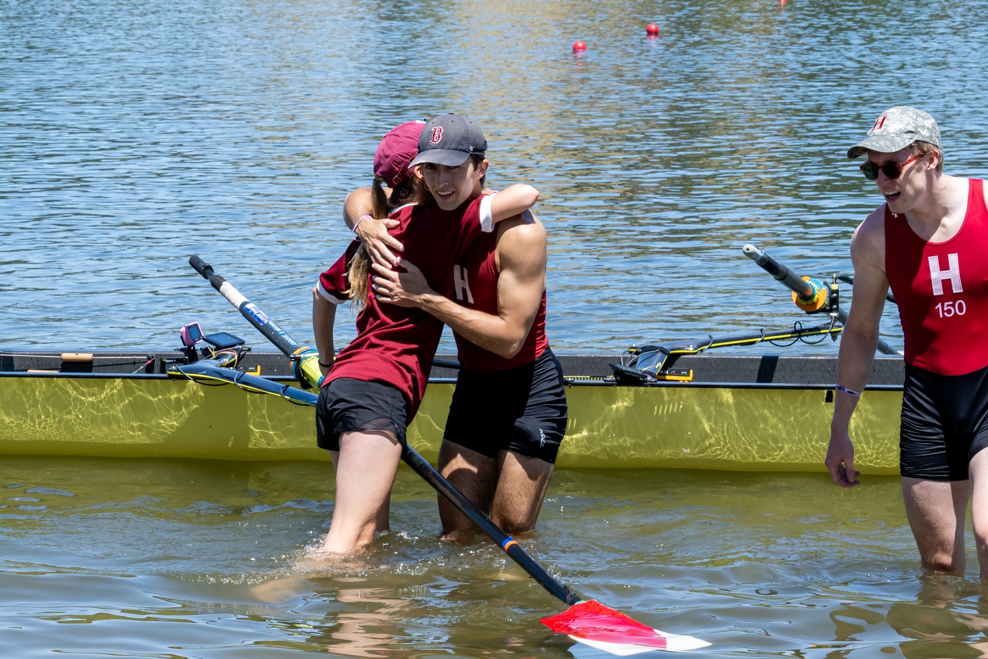 Ben Lundie is embraced by coxswain Nathalie Gregg after the varsity's national championship winning race in 2026.
