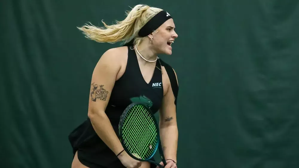 Women's Tennis Student Athlete Karolina Skowronska holding tennis racket 