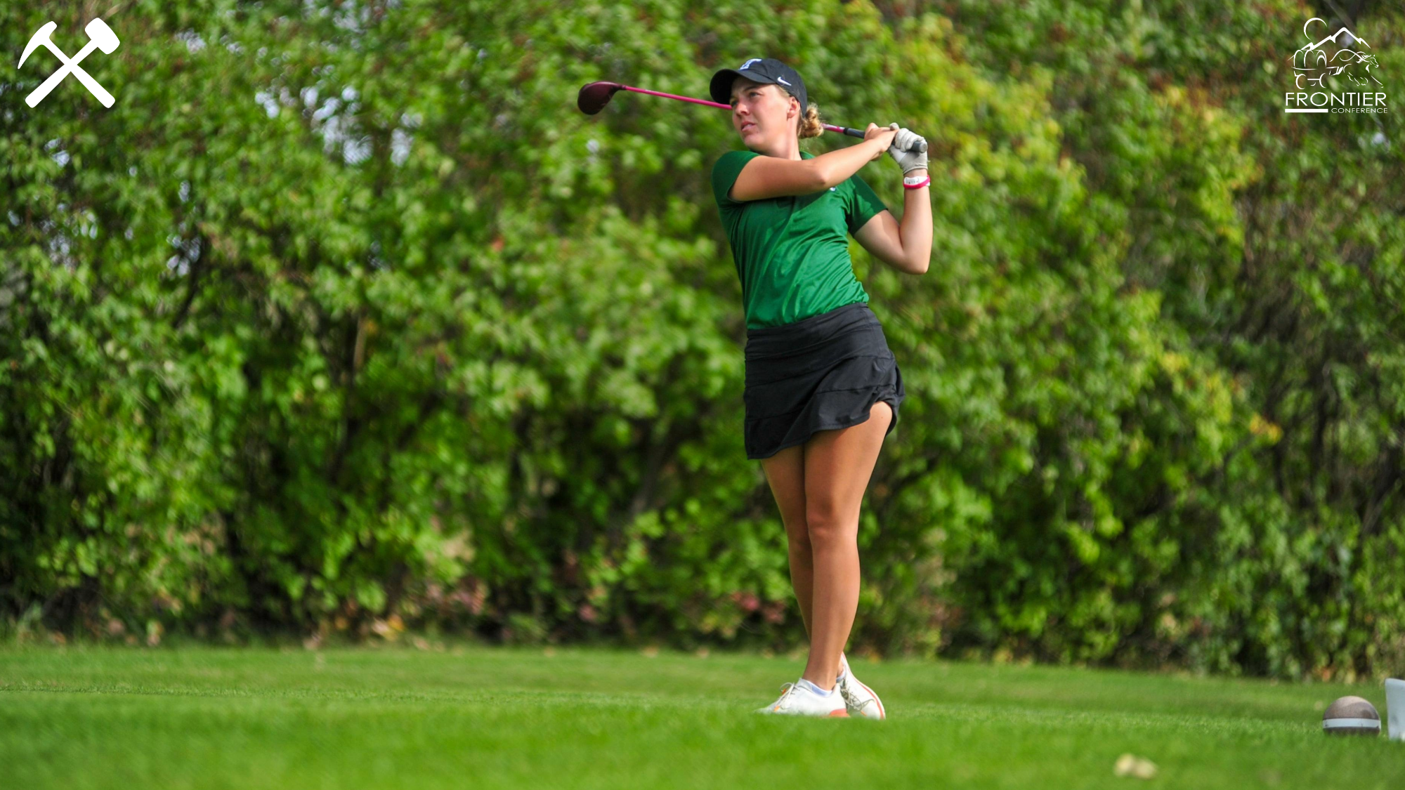 Casha Corder watches a tee shot fly during a Montana Tech golf tournament
