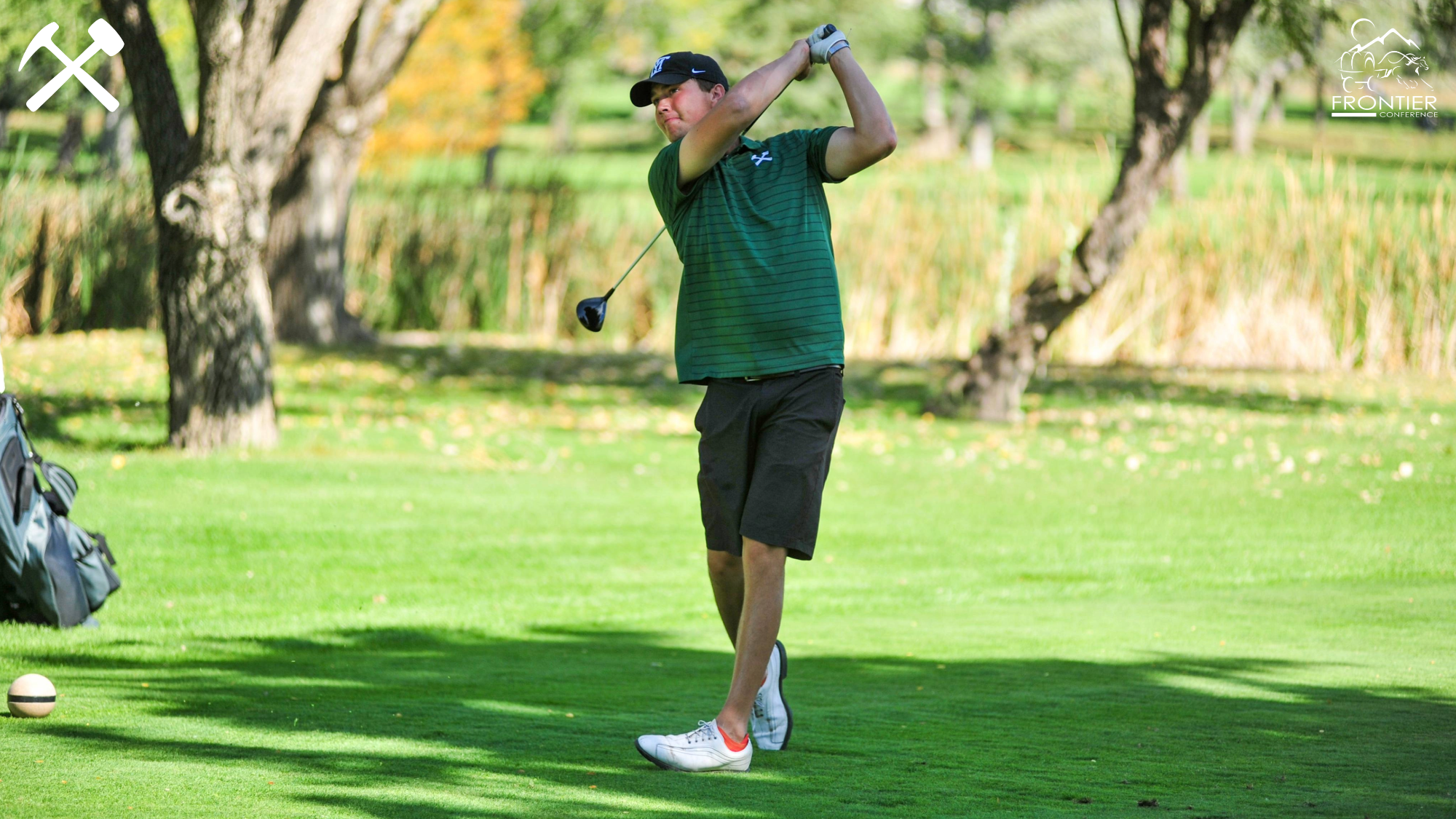 Trey Mattson watches a tee shot during a college golf tournament