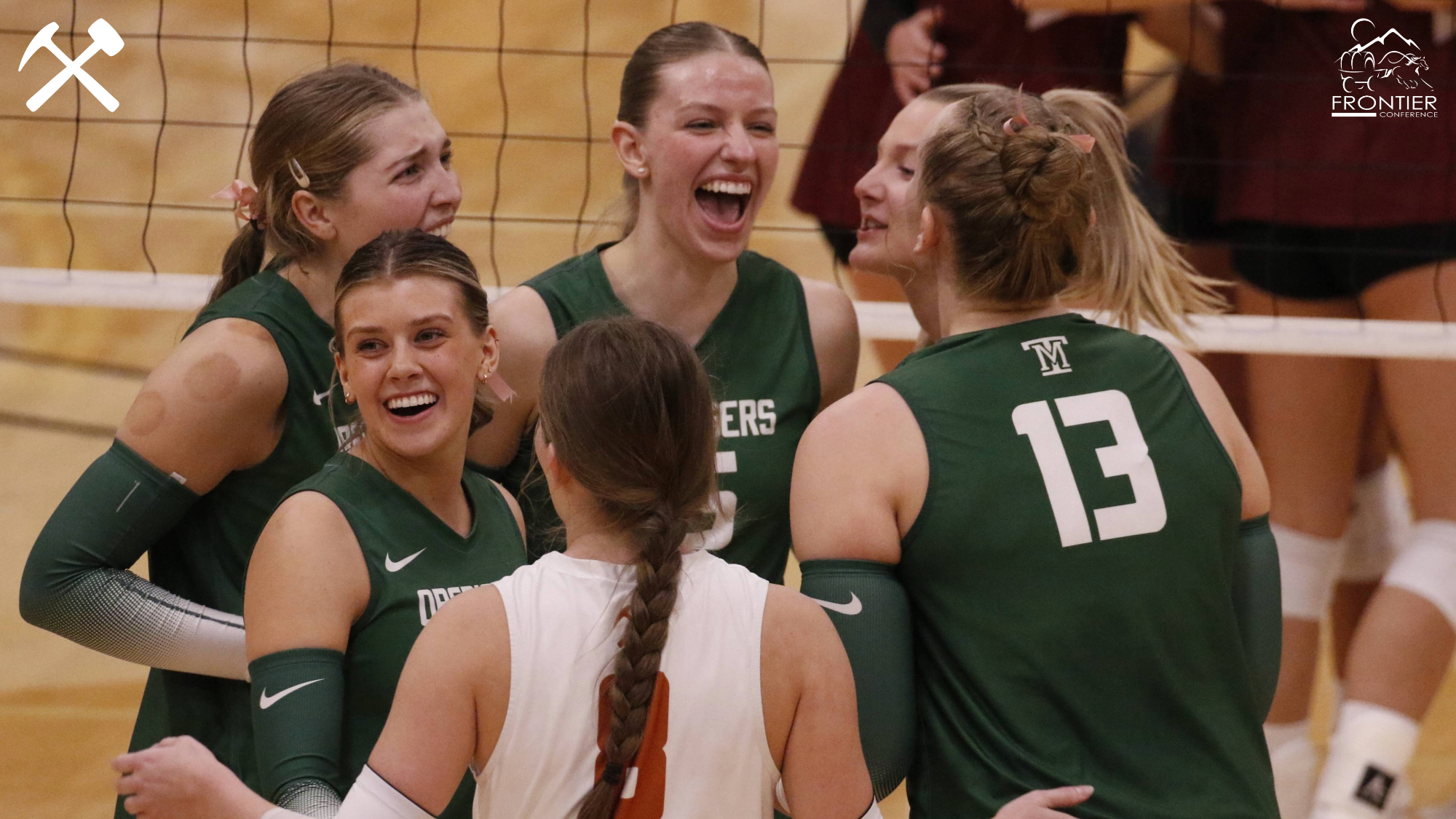 Montana Tech volleyball players huddle during a match