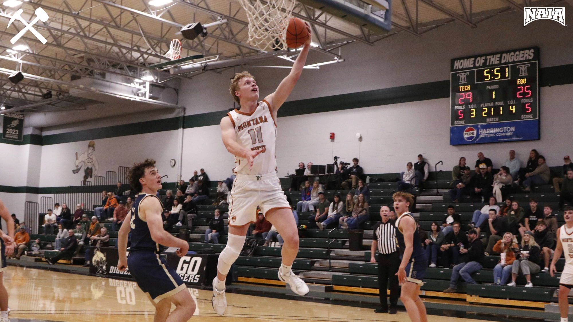 Hayden Diekhans leaps for an uncontested layup during a Montana Tech men's basketball game.