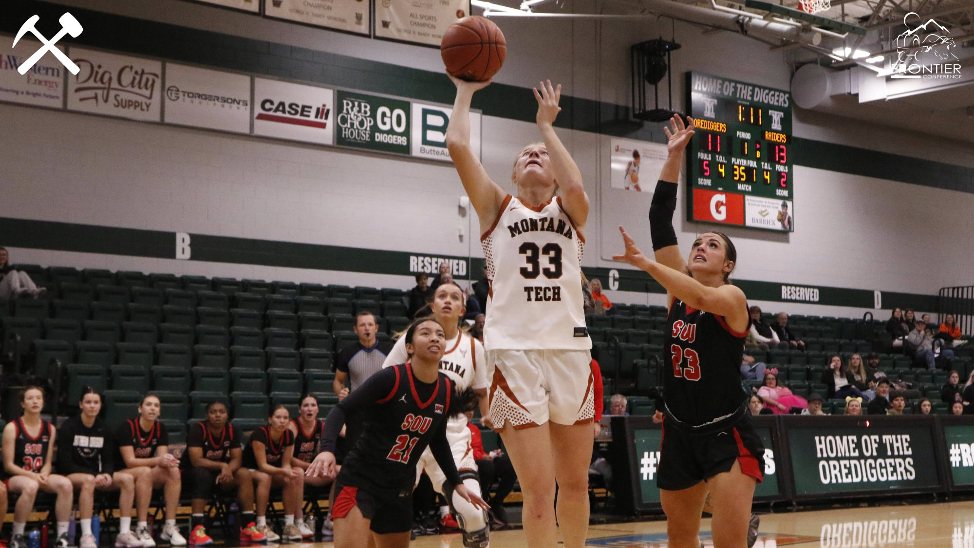 Hallie Neibauer lays the ball in the basket during a Montana Tech women's basketball home game.