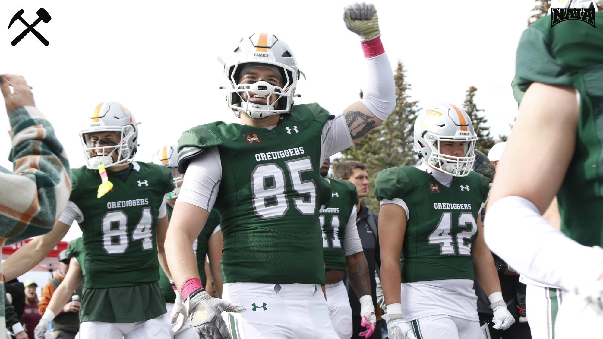 Montana Tech football players participate in the Digger Walk prior to a home football game