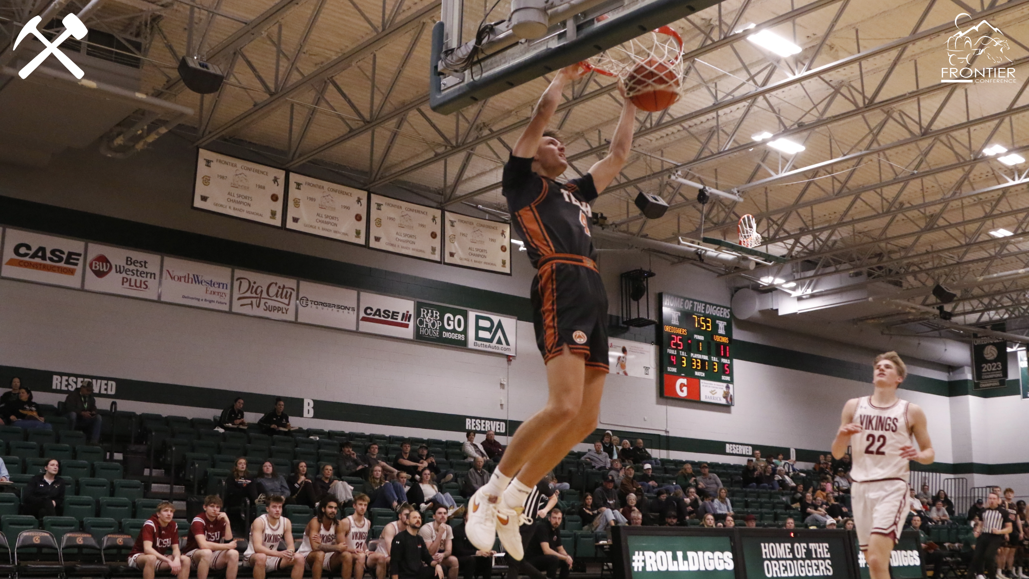 Ethan Venema dunks the basketball during a Montana Tech home game