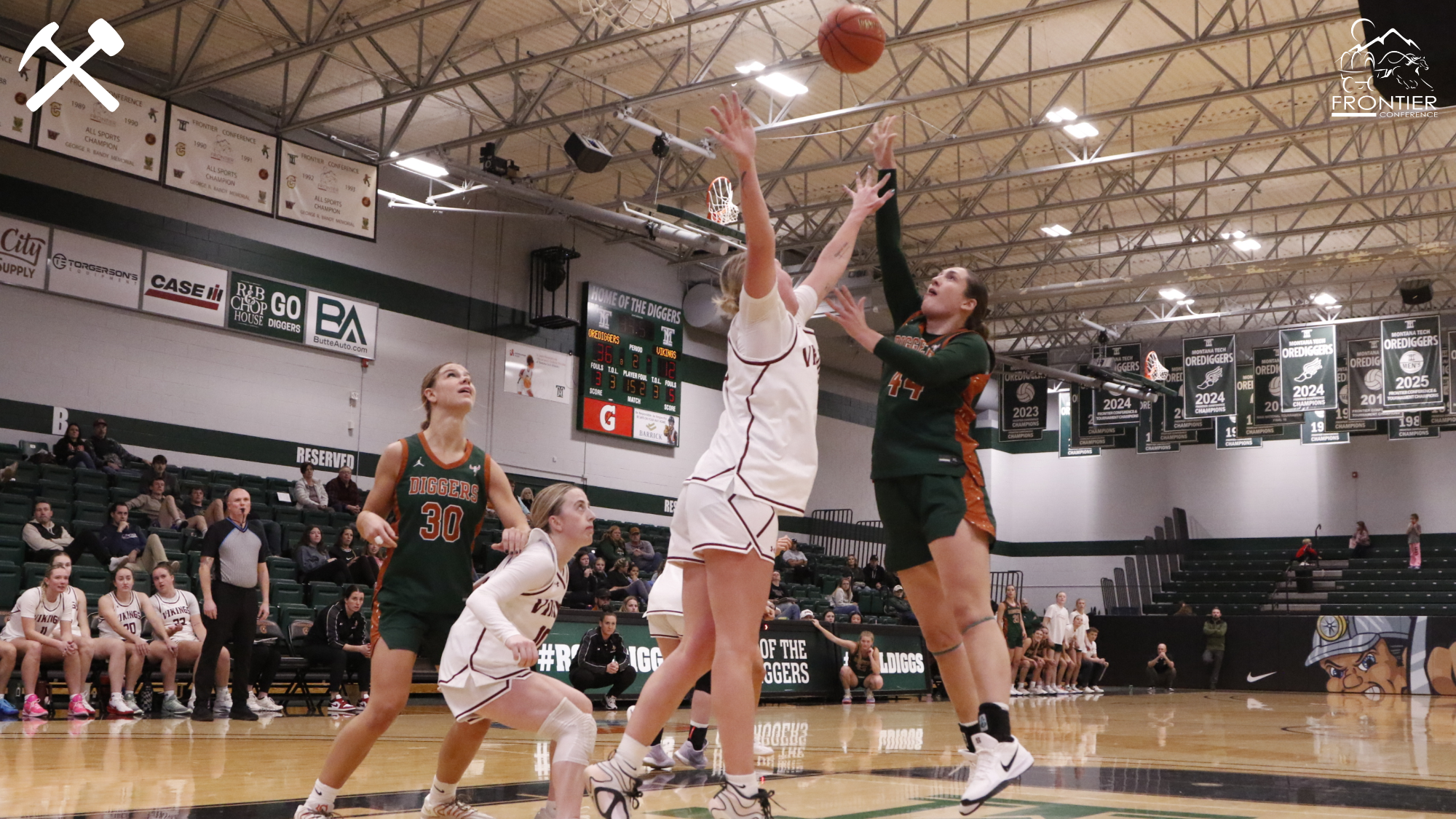 Hadley Humpherys shoots the basketball over a defender during a Montana Tech home game