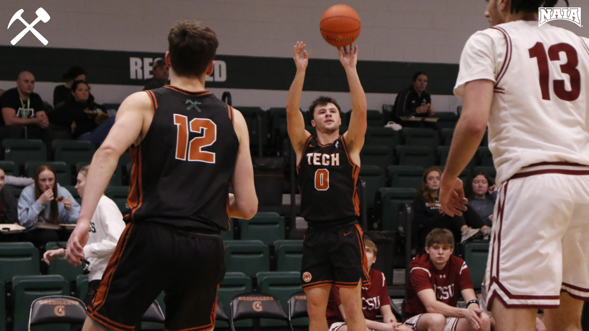 Montana Tech men's basketball player shooting a jump shot during a home game