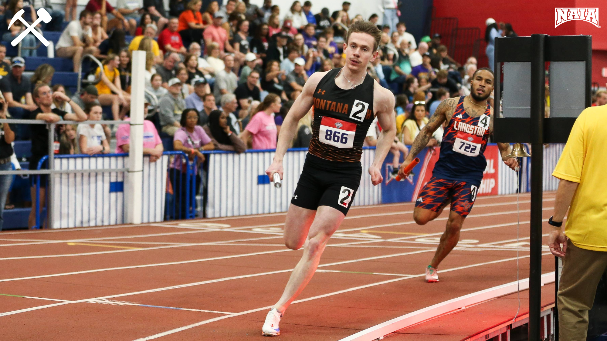 Matt Moreni running in an indoor track meet