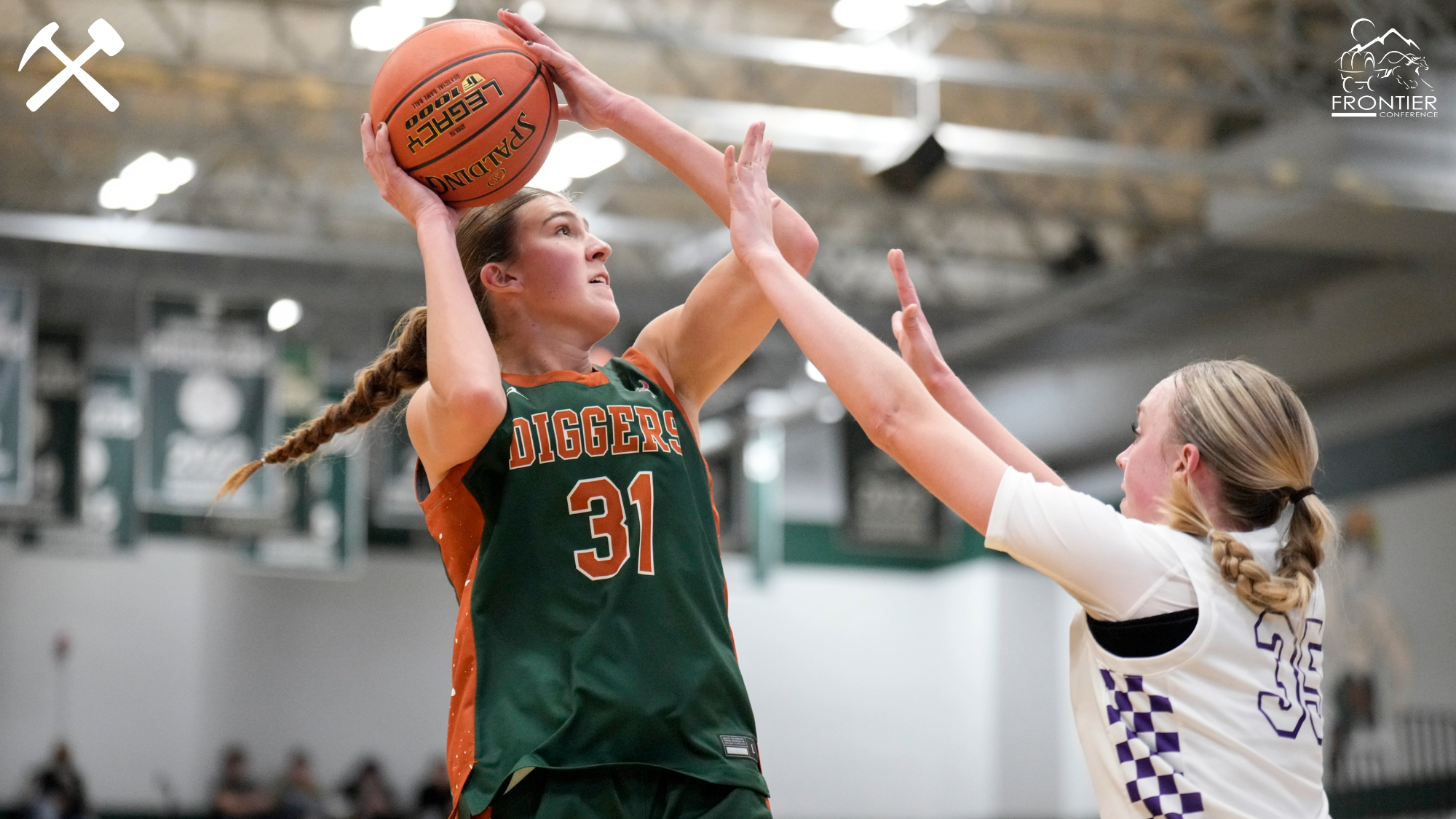 Halle Haber shoots over a Carroll College defender in a Montana Tech women's basketball game
