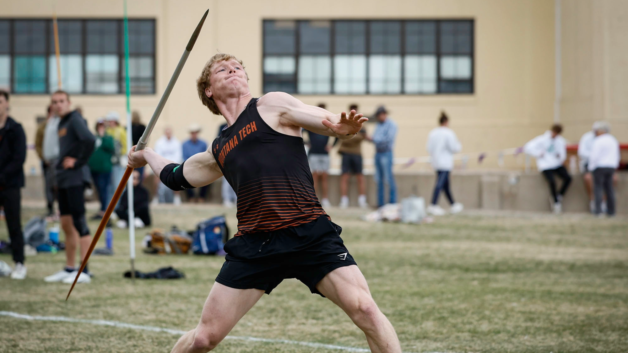 A Montana Tech field athlete throwing the javelin