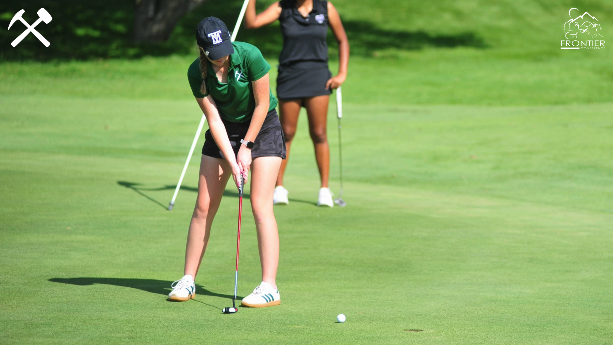 Emma Woods putting in a Montana Tech golf tournament