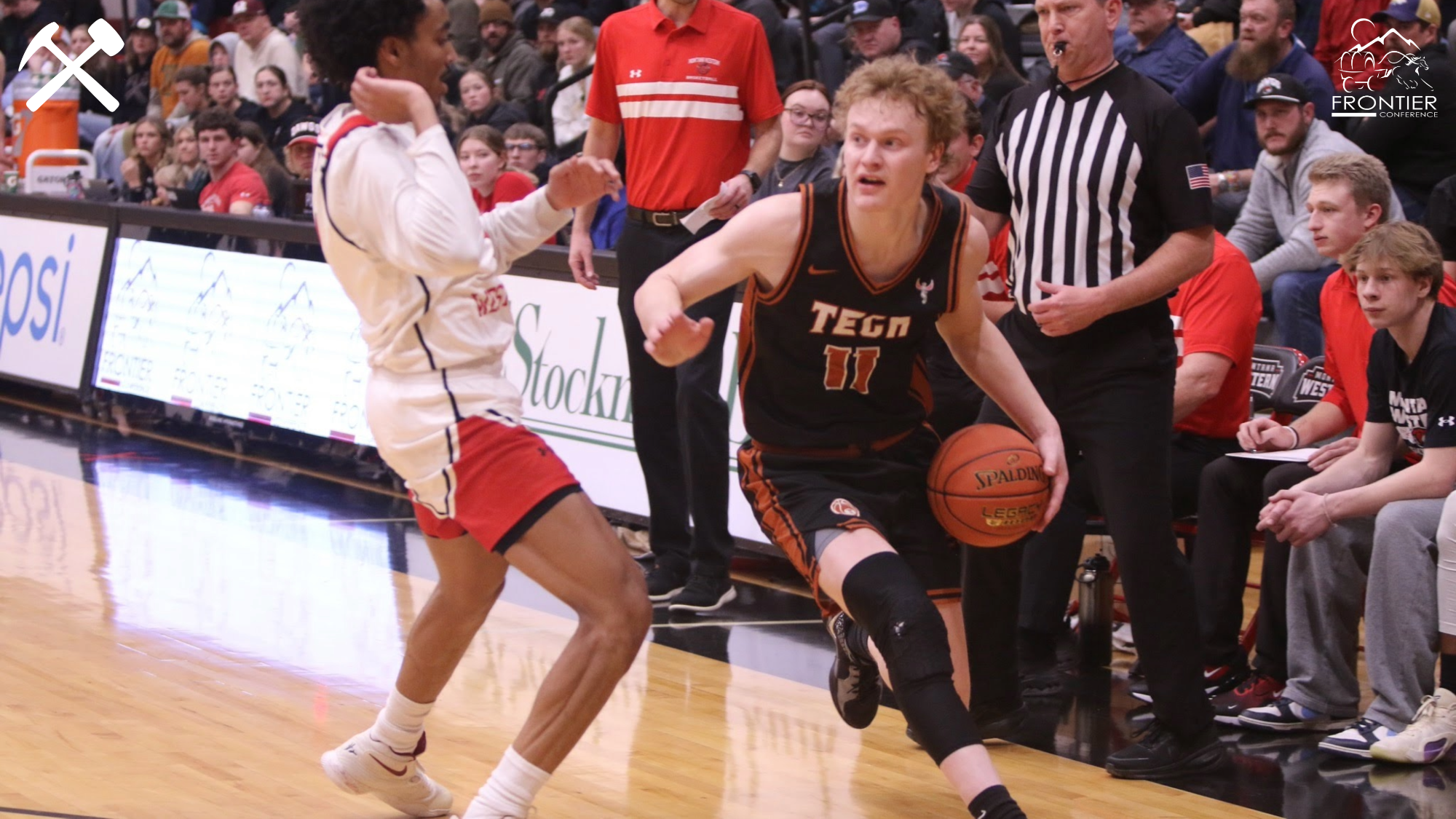 Hayden Diekhans drives in a baskebtall game