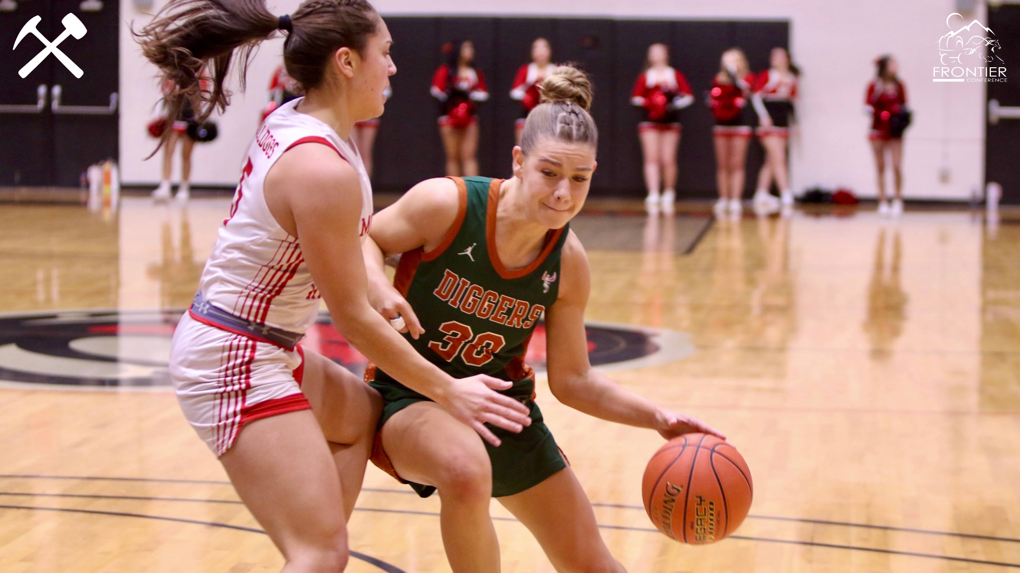 Liv Wangerin drives against a defender in a Montana Tech women's basketball game