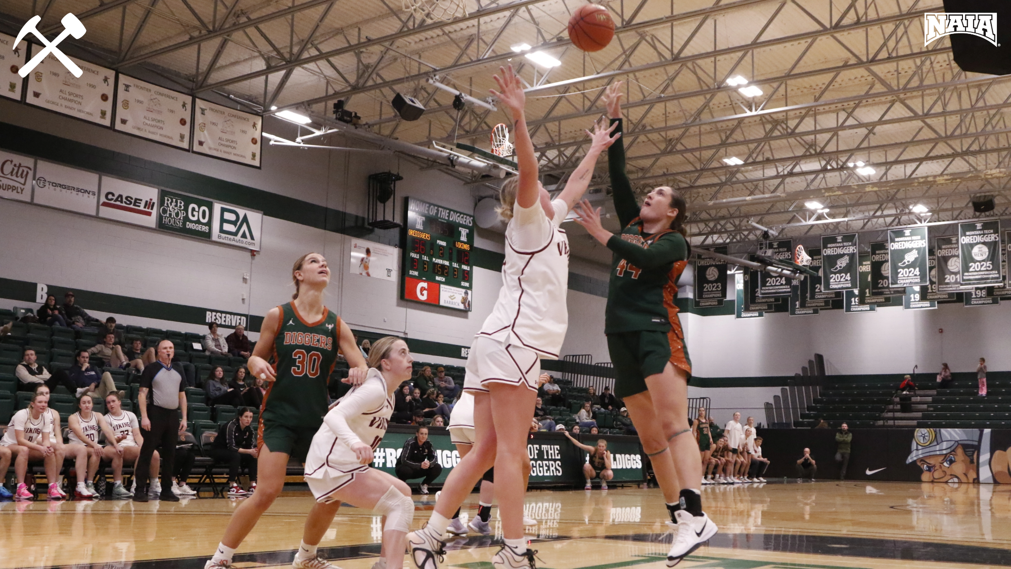 Hadley Humpherys shoots overtop a defender during a Montana Tech women's basketball game