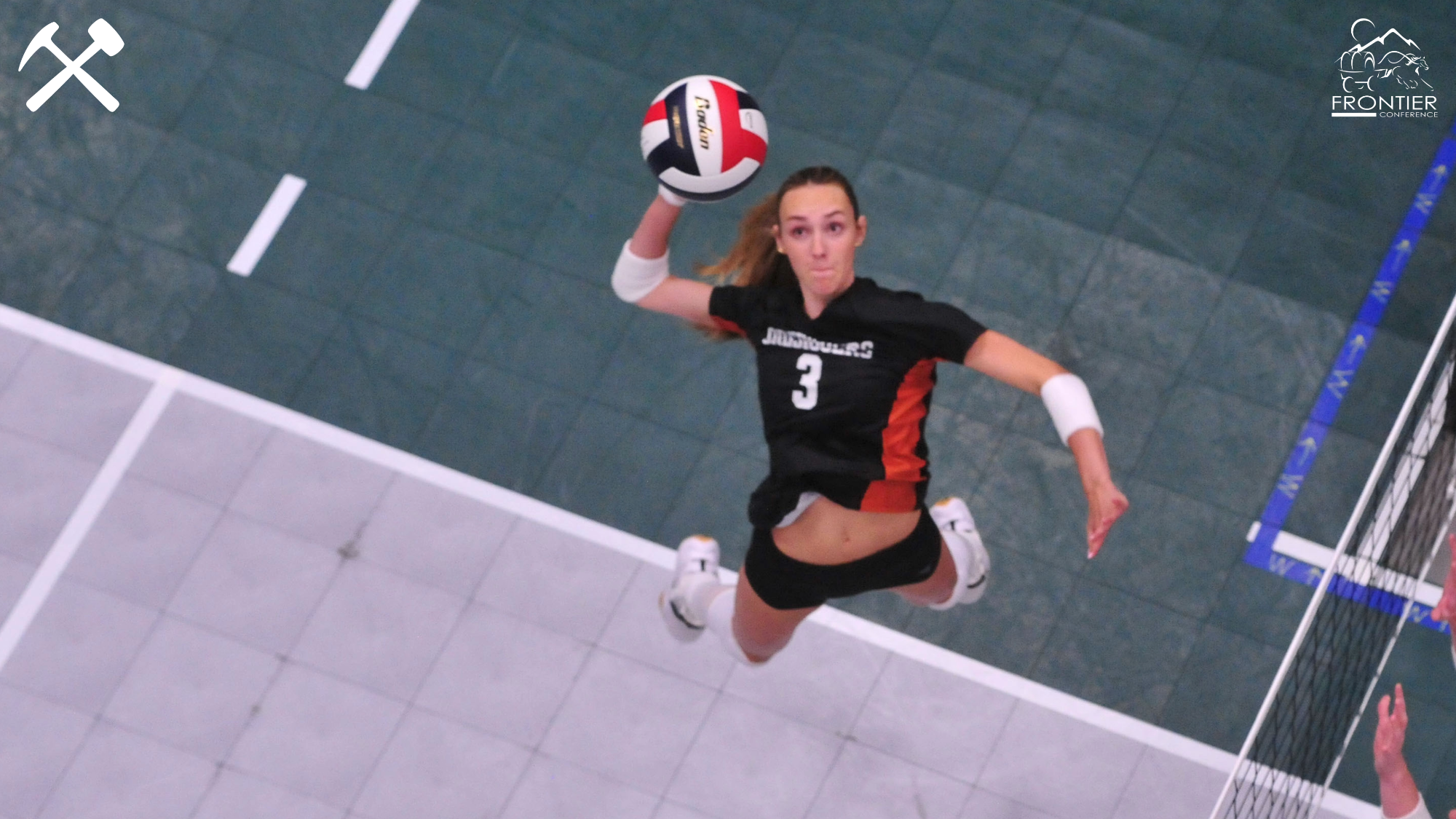 A Montana Tech vollleyball players hits a shot
