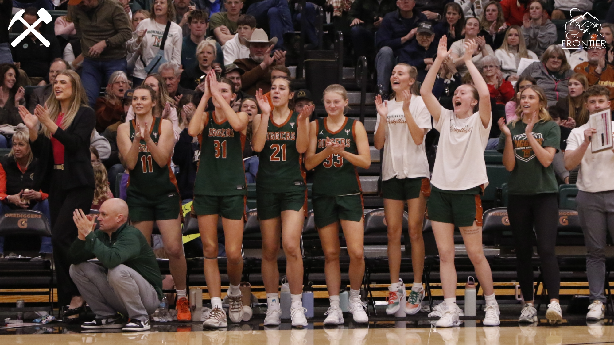 Montana Tech's women's basketball bench celebrates a good play during a home game