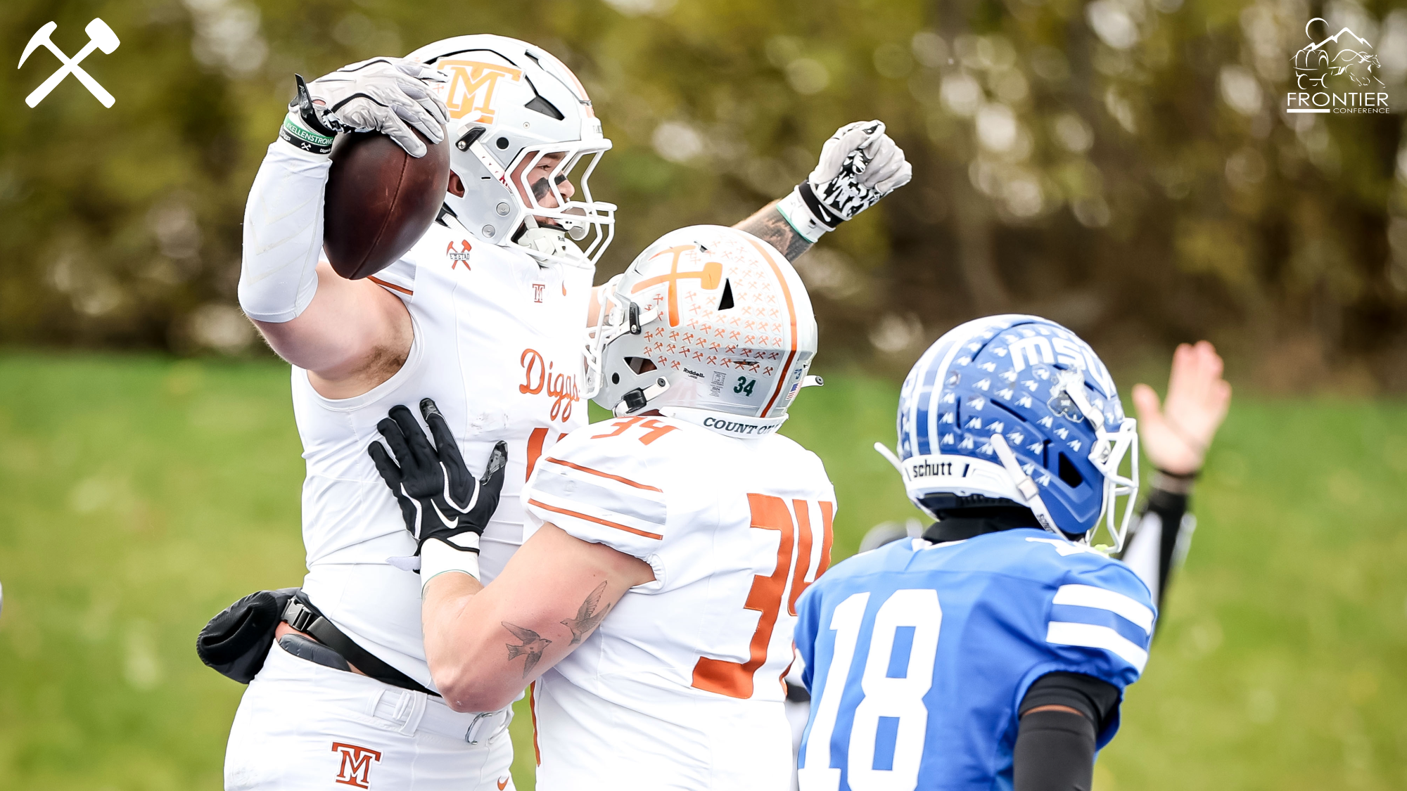 Luke Bilau celebrates a touchdown catch with a teammate