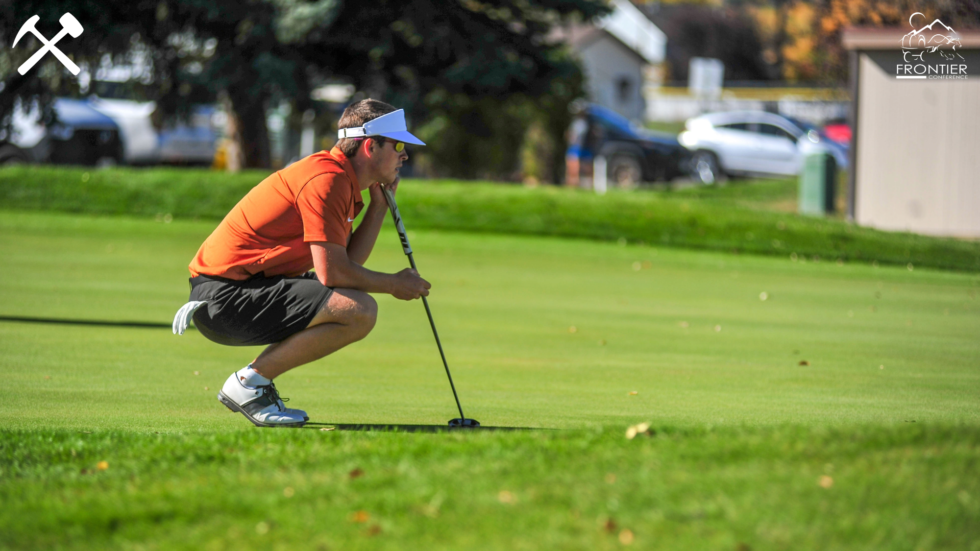 Tyler Avery reads a putt during a Montana Tech golf round