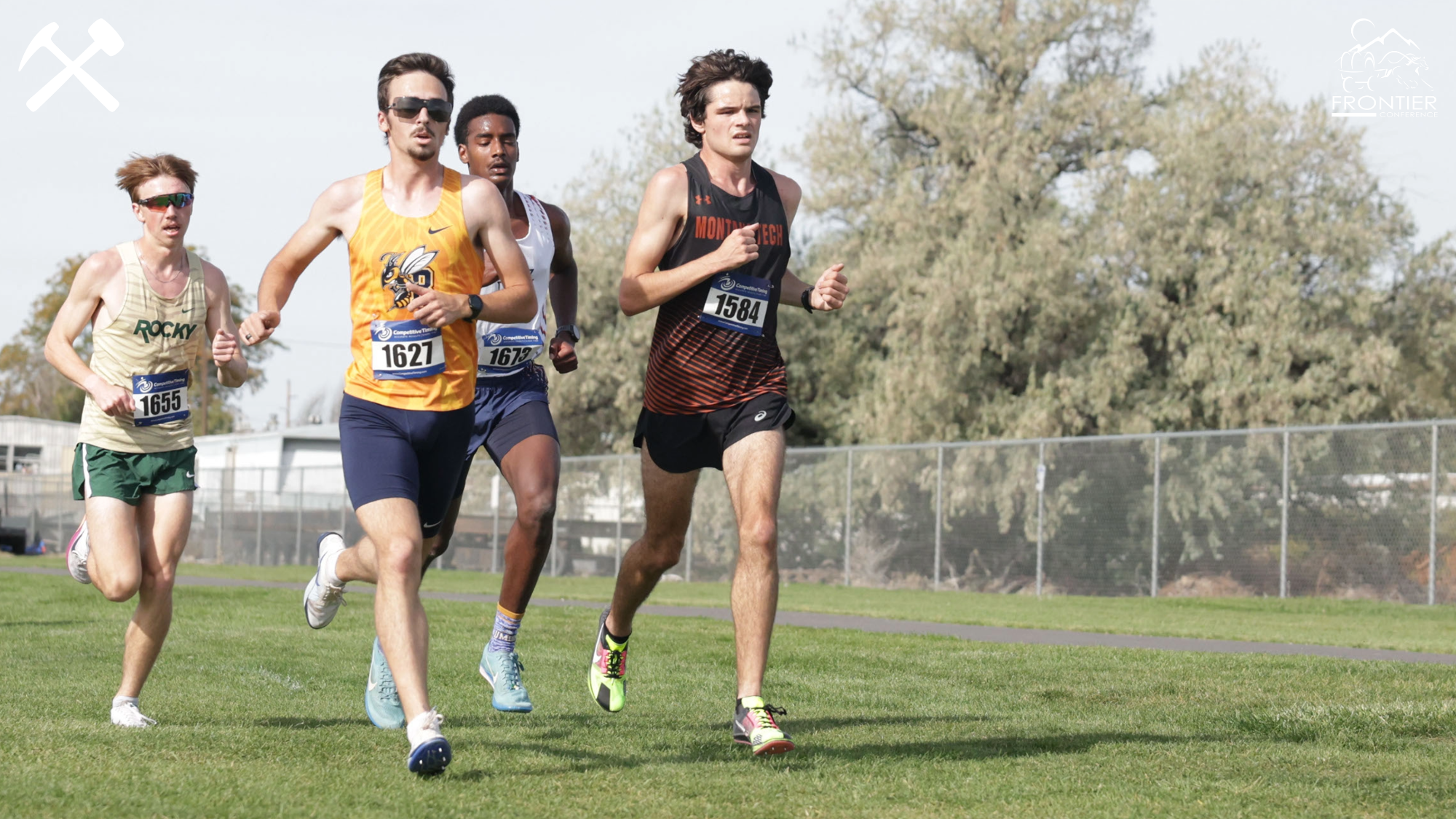 Tyler Inabnit races other runners in a cross country meet