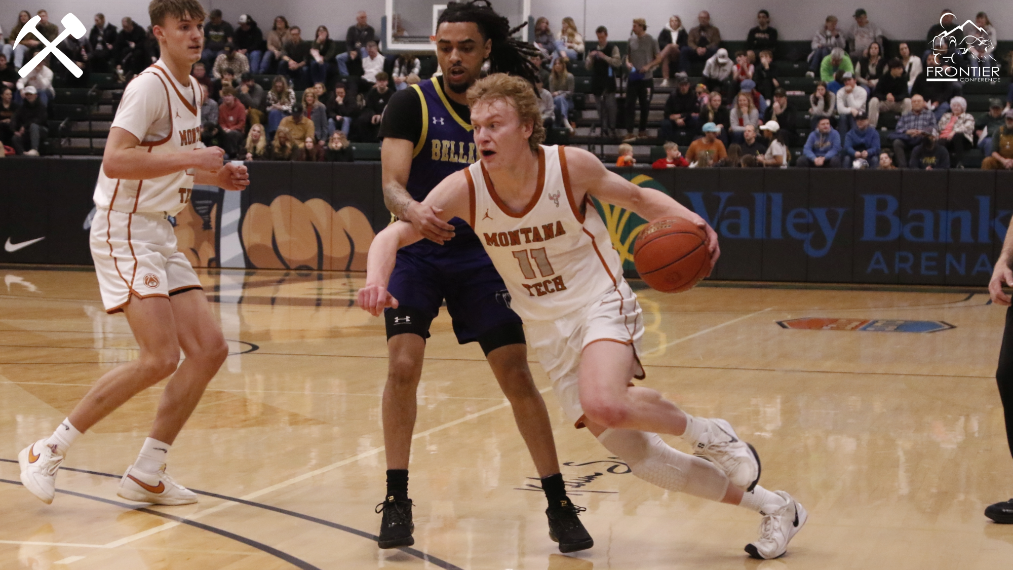 Hayden Diekhans drives with the basketball during a Montana Tech home basketball game