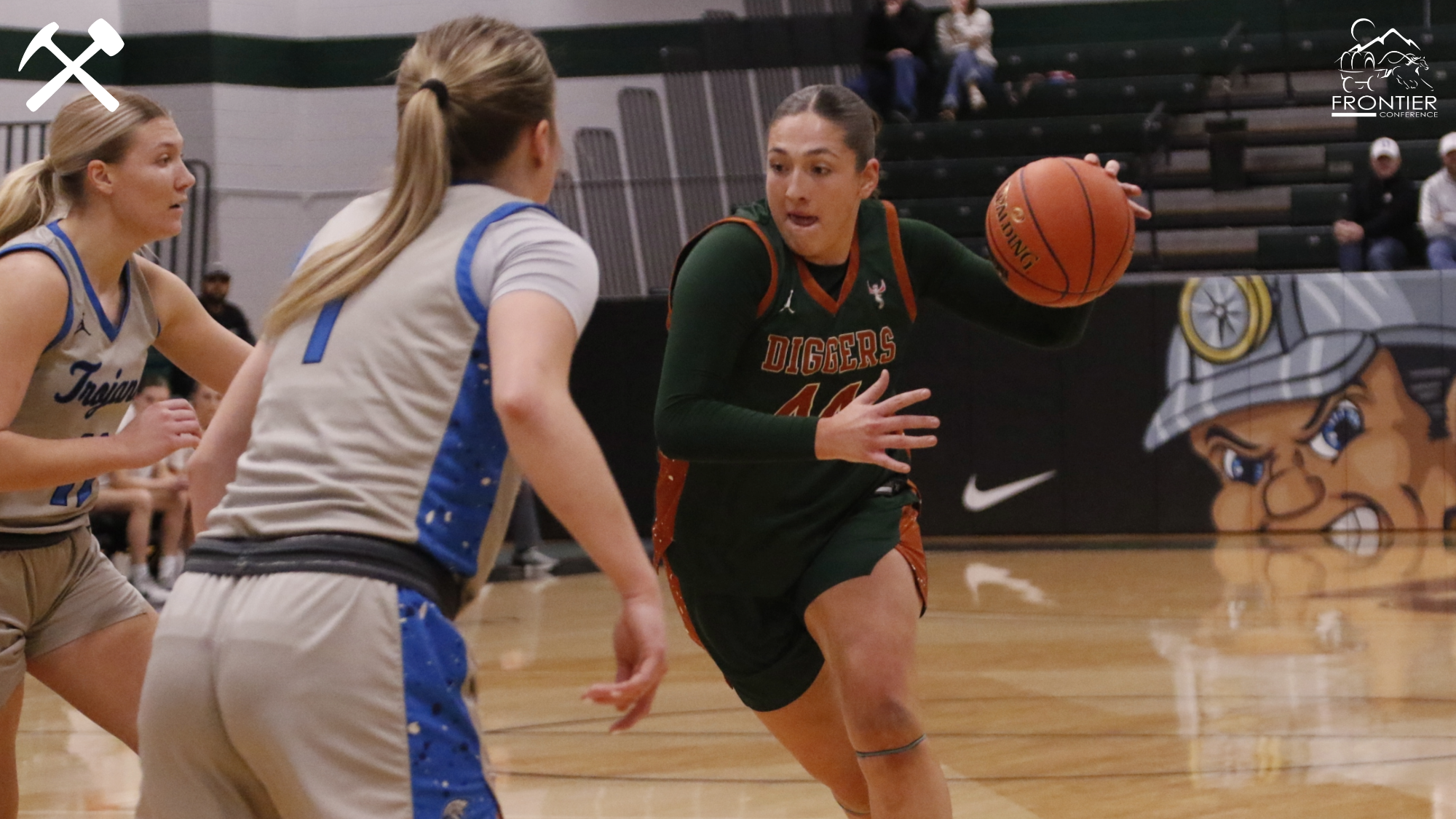 Hadley Humpherys drives against an opponent in a Montana Tech women's basketball game