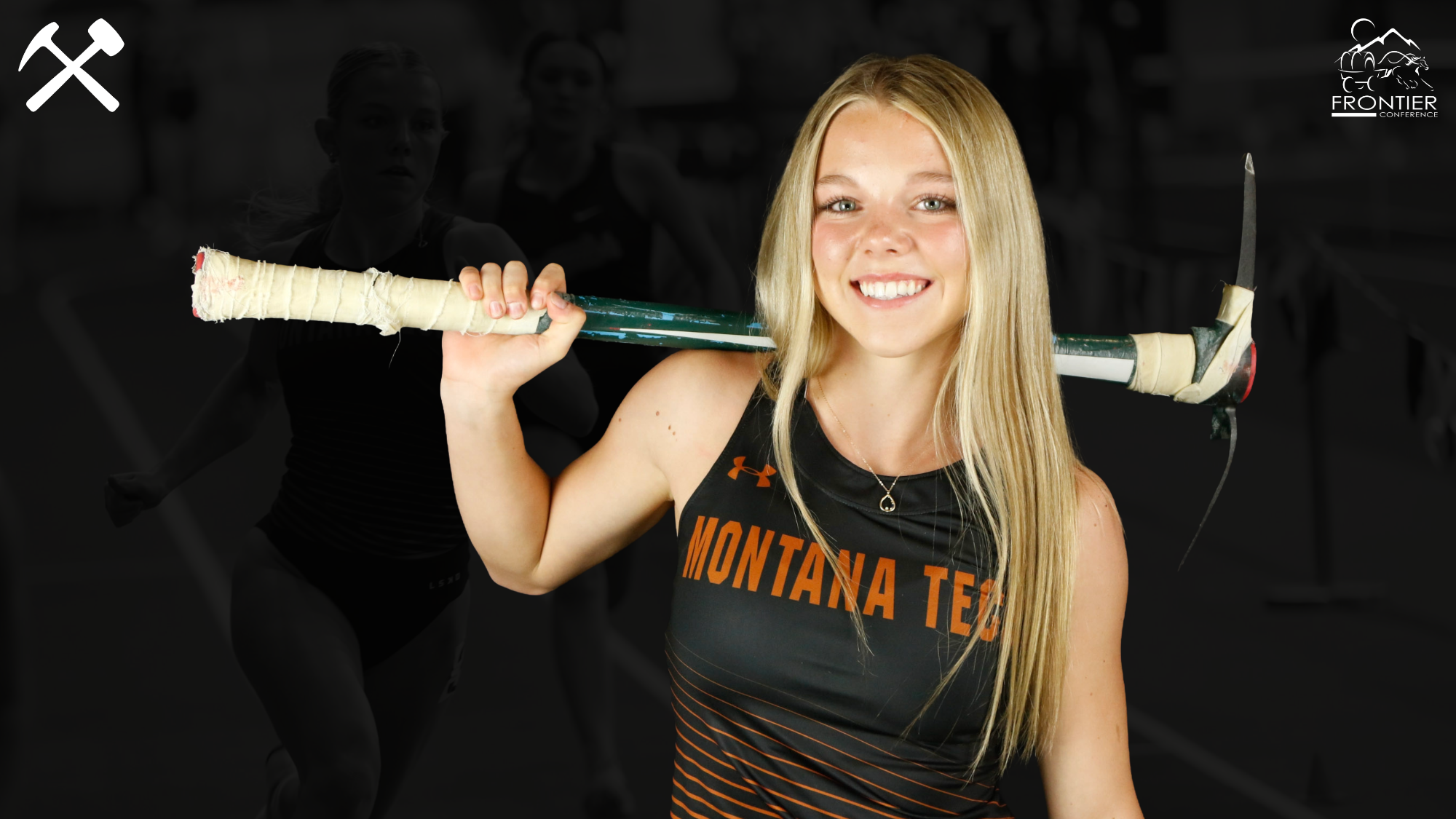 Ayla Janzen poses in her Montana Tech track & field uniform with a pickaxe over her shoulder