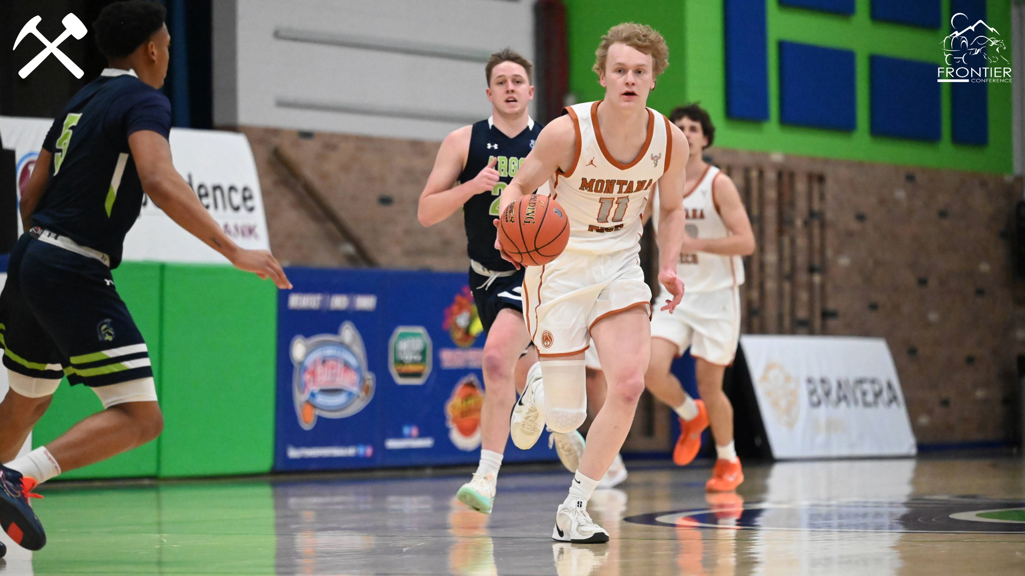 Hayden Diekhans dribbling in a Montana Tech men's basketball game