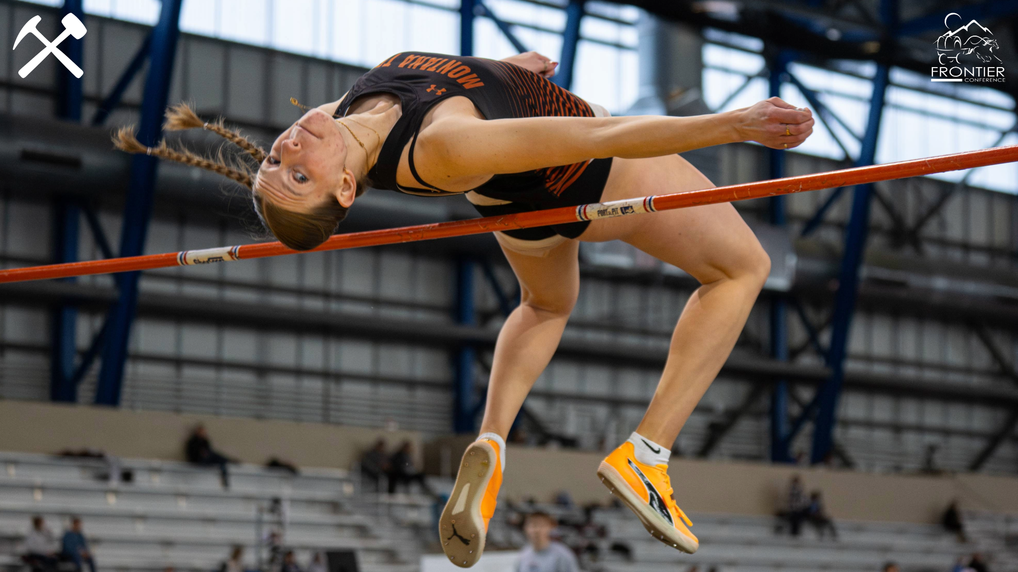 Abby Clark clears the high jump bar at a track & field meet