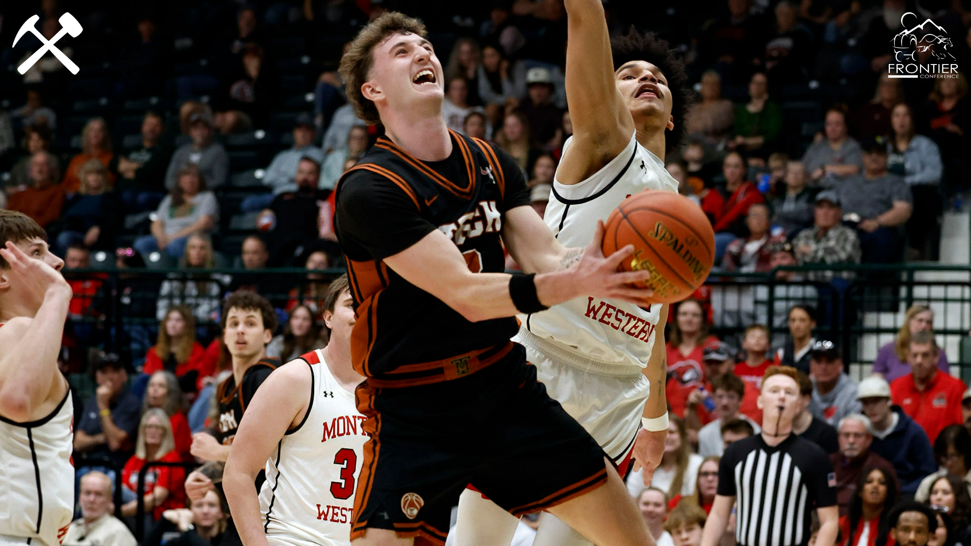 Brayden Koch shoots a contested layup in Montana Tech men's basketball's Frontier Conference tournament quarterfinal win over Montana Western at the Butte Civic Center
