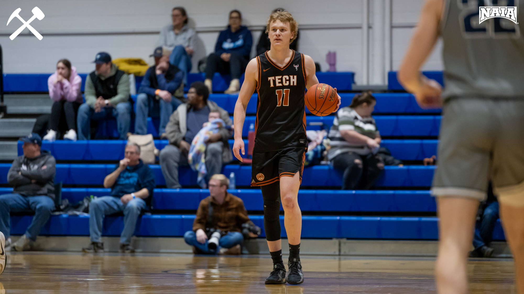 Hayden Diekhans dribbles the ball upcourt in a Montana Tech men's basketball game