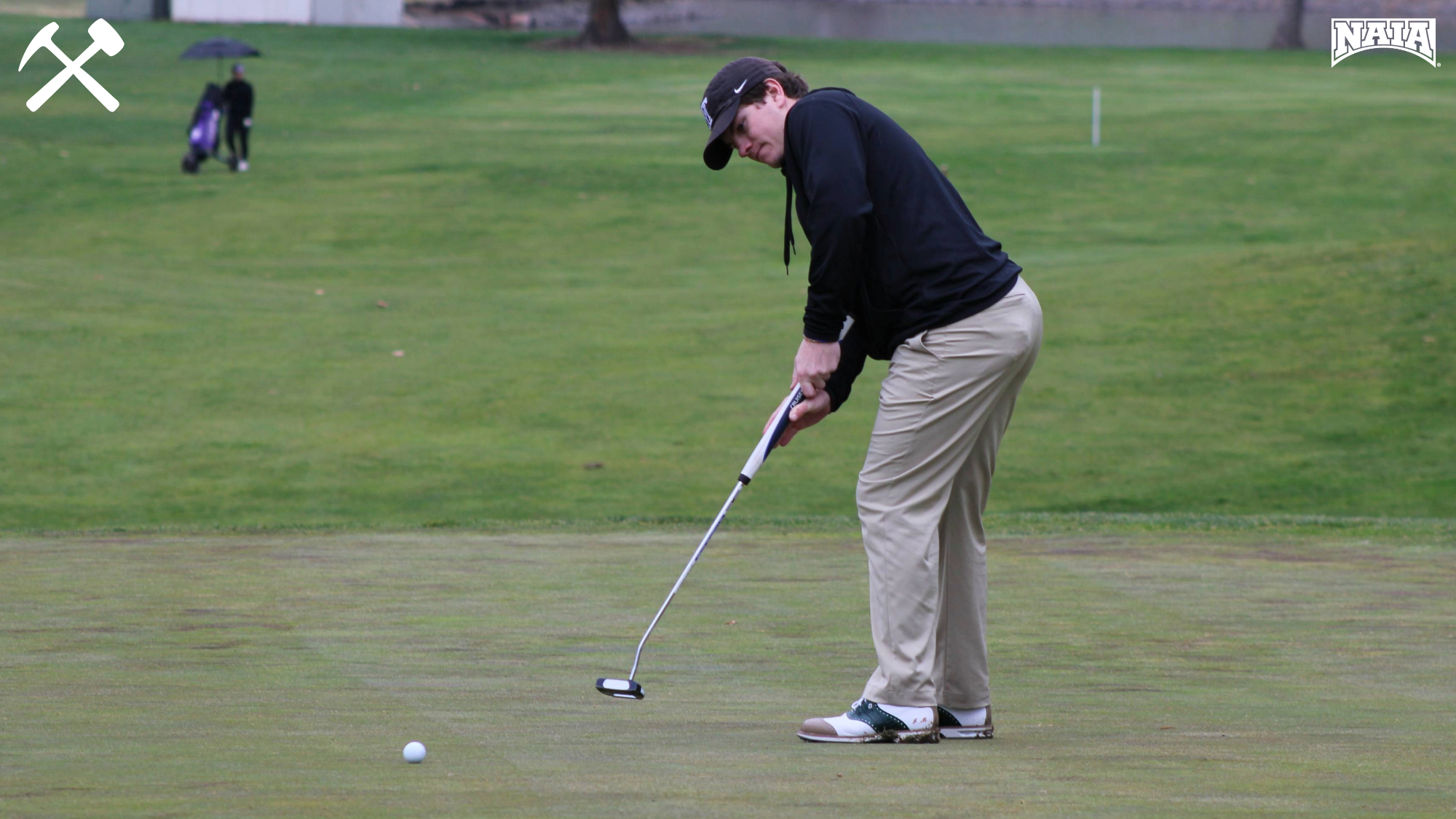 Joe McGreevey putts during a Montana Tech golf tournament