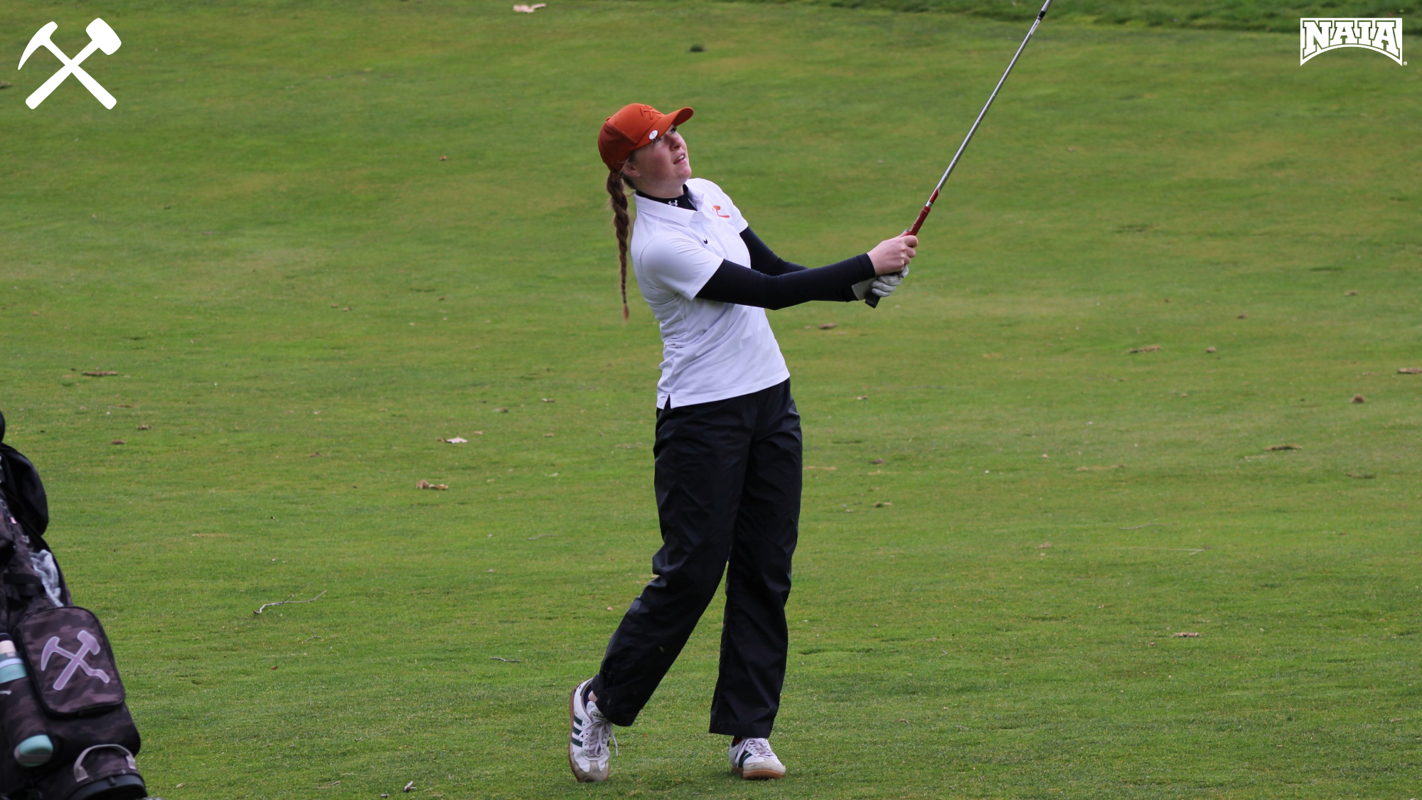 Emma Woods watches a golf shot fly during a tournament