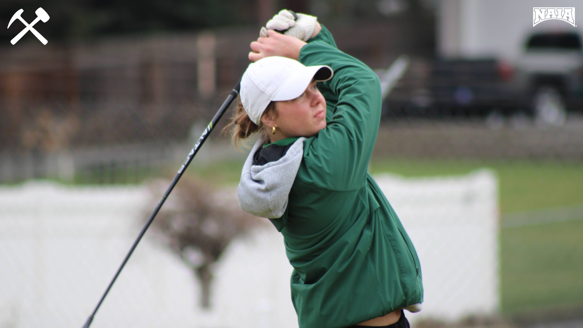 Keni Wade follows through on a golf shot