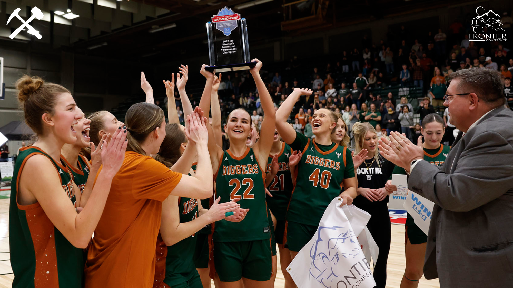 Montana Tech's Brooke Badovinac lifts the Frontier Conference tournament championship trophy surrounded by her Montana Tech teammates