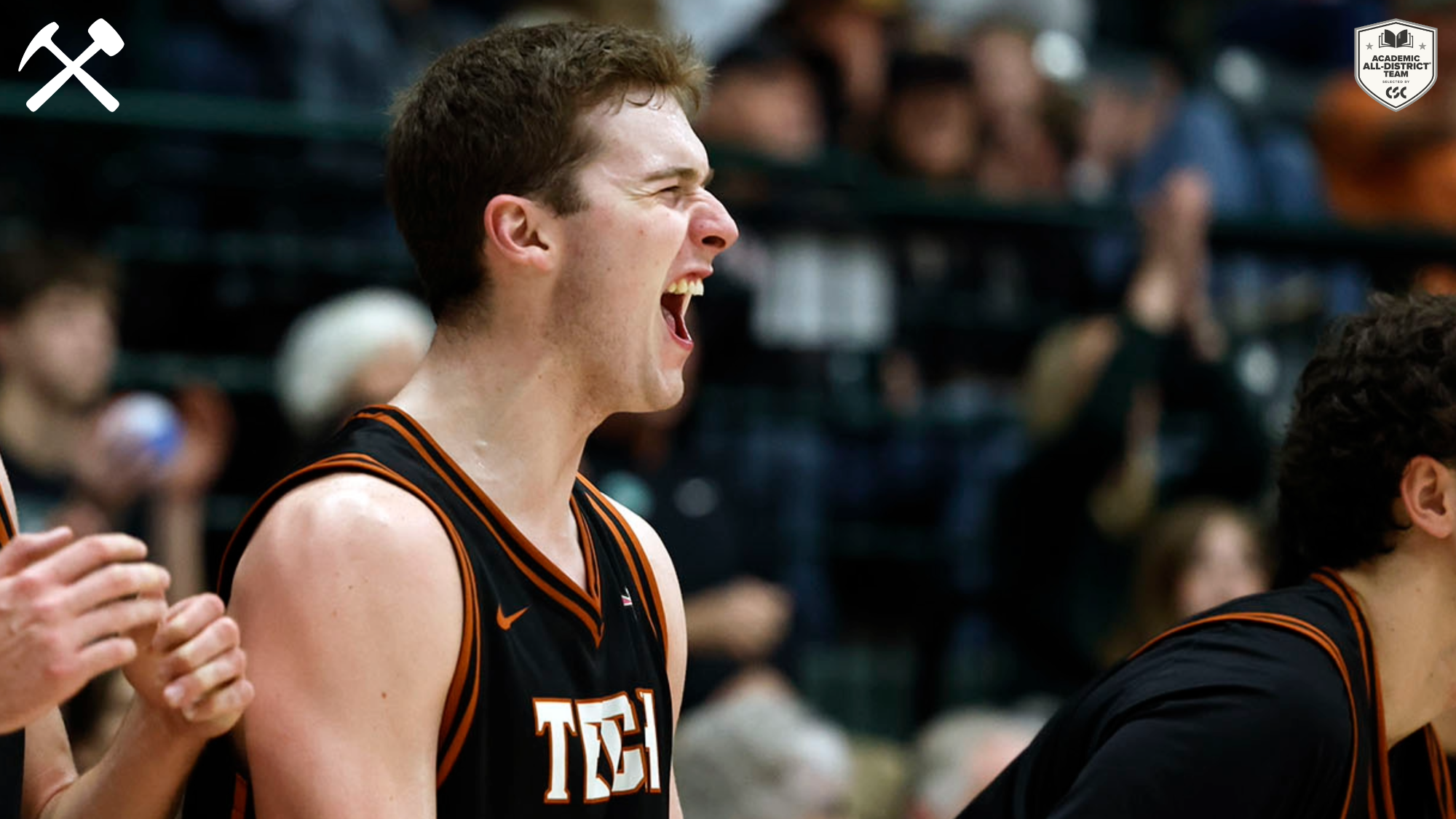 Connor Michaud celebrates a Montana Tech basket during a men's basketball game