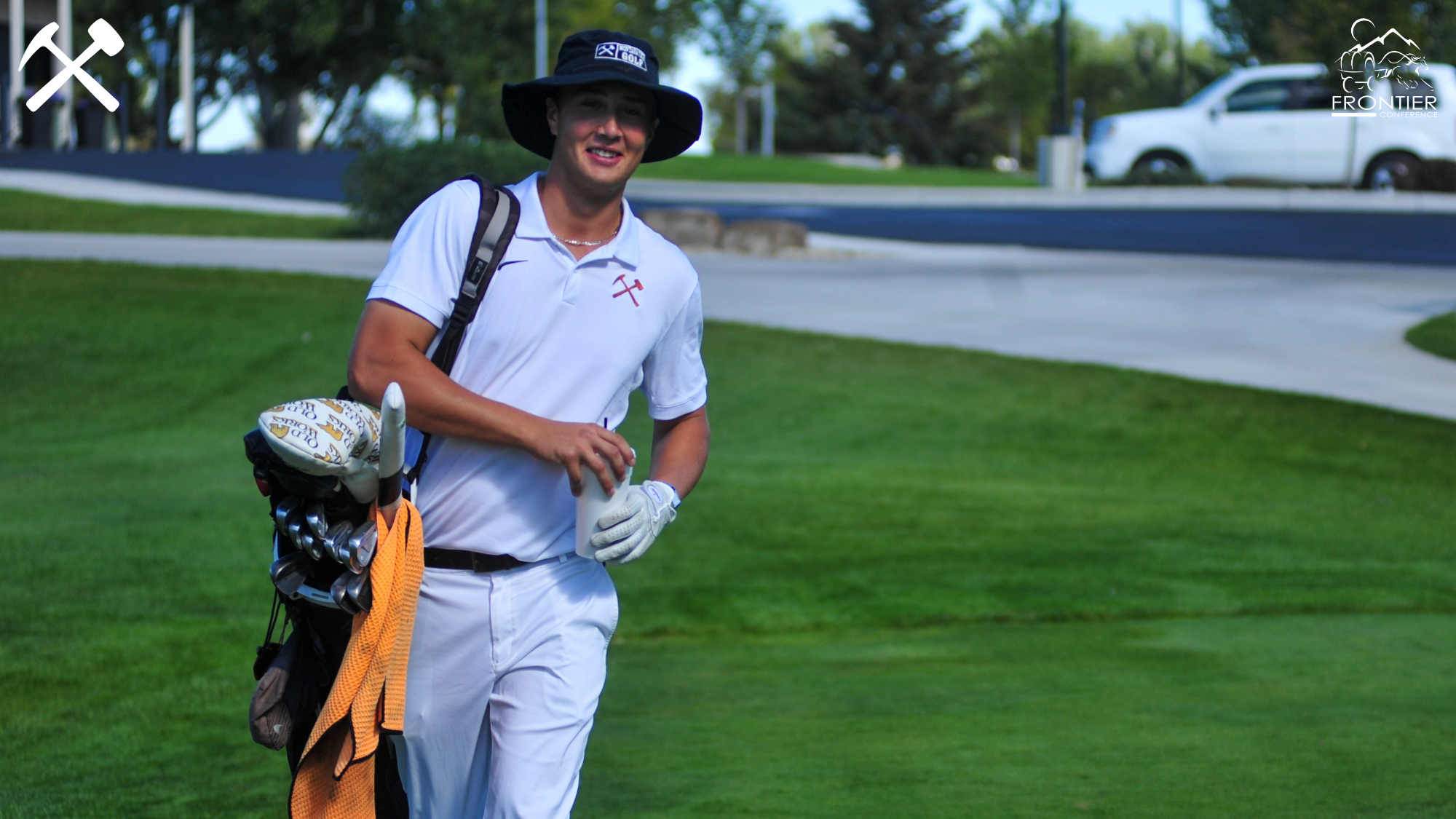 Trey Mattson walking with his golf bag