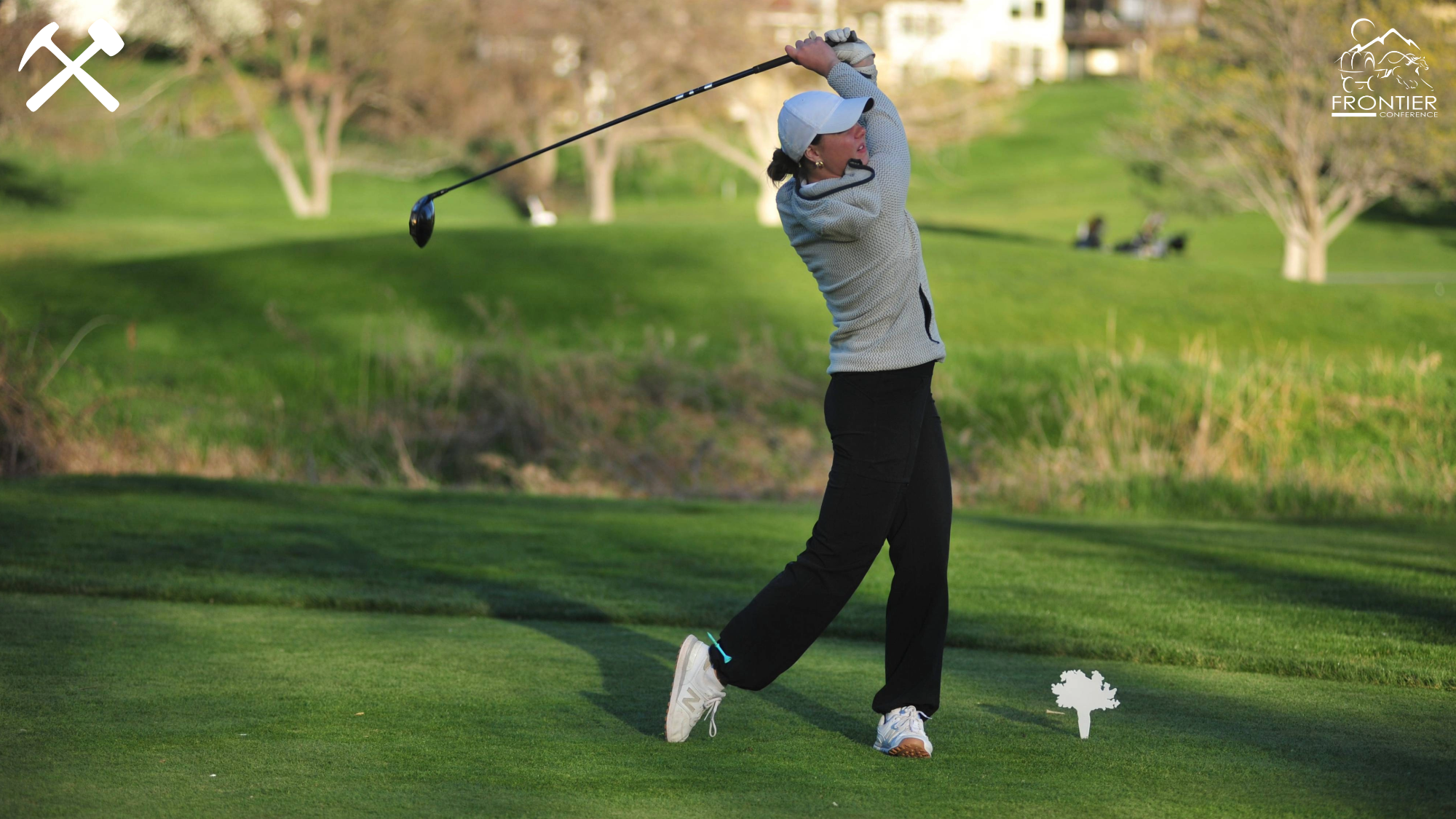 Keni Wade hits a drive during a golf tournament