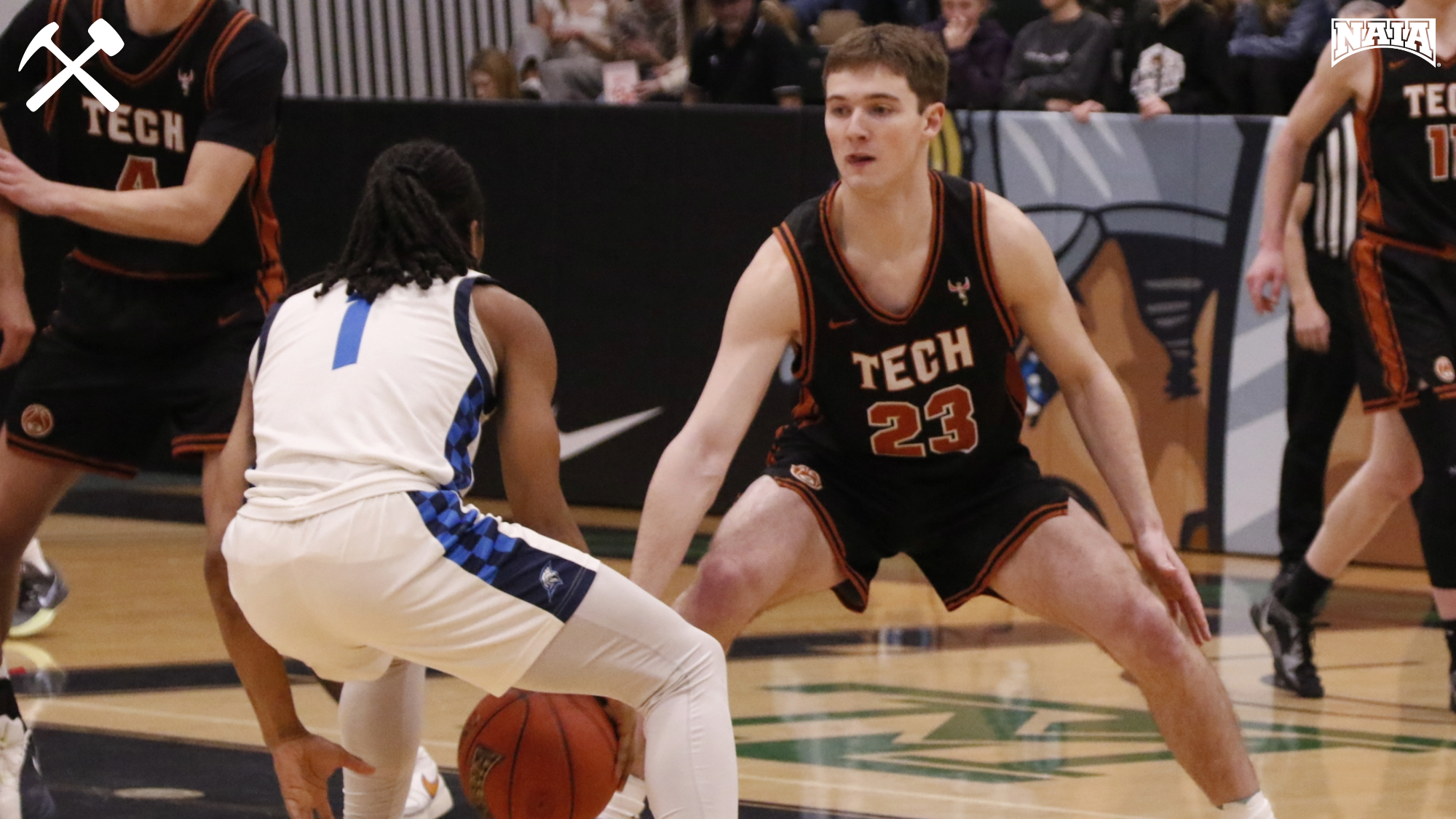 Connor Michaud playing defense in a Montana Tech men's basketball game