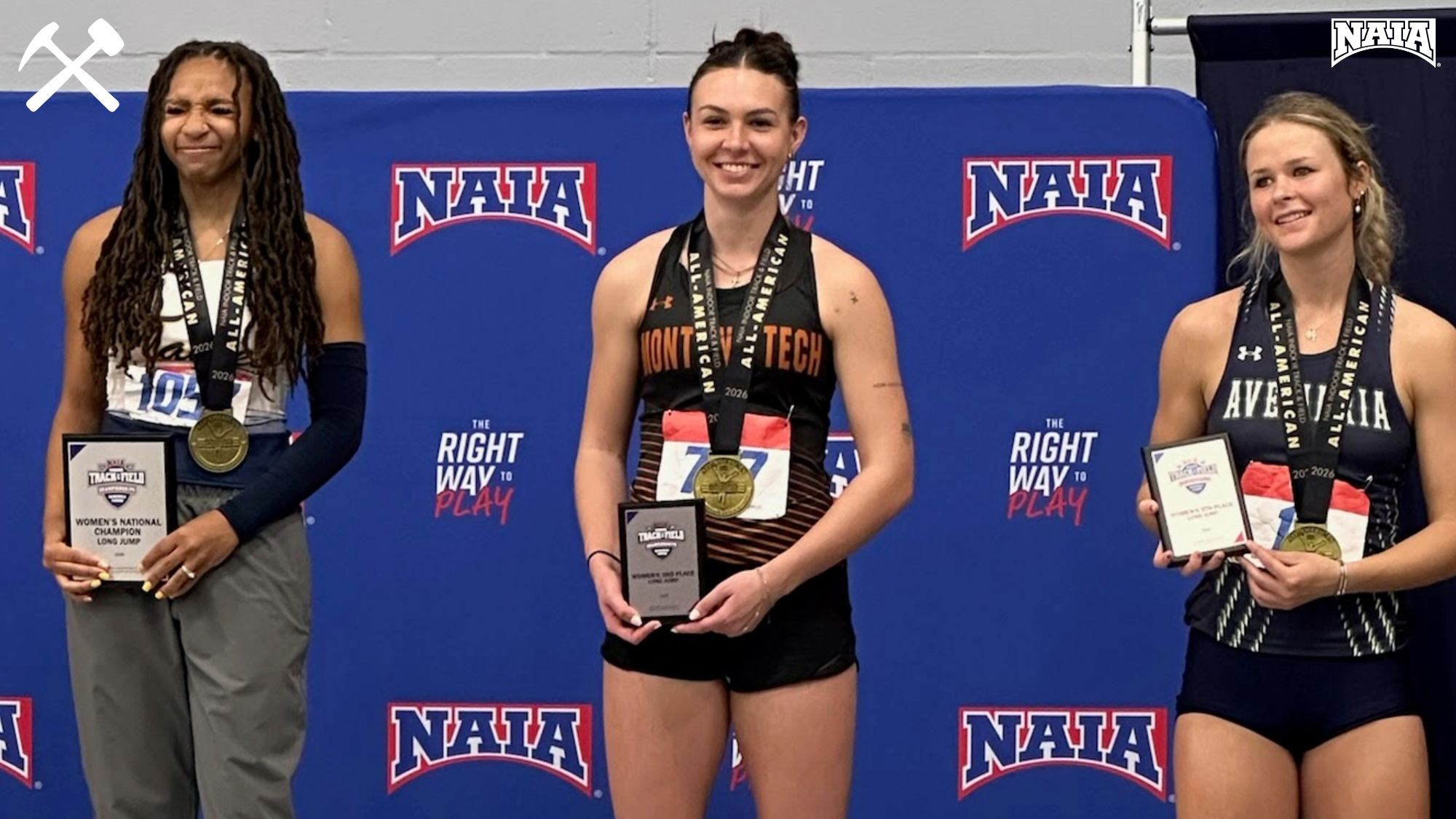 Jadyn Vermillion stands on the podium with her third-place plaque in the women's long jump at NAIA indoor nationals