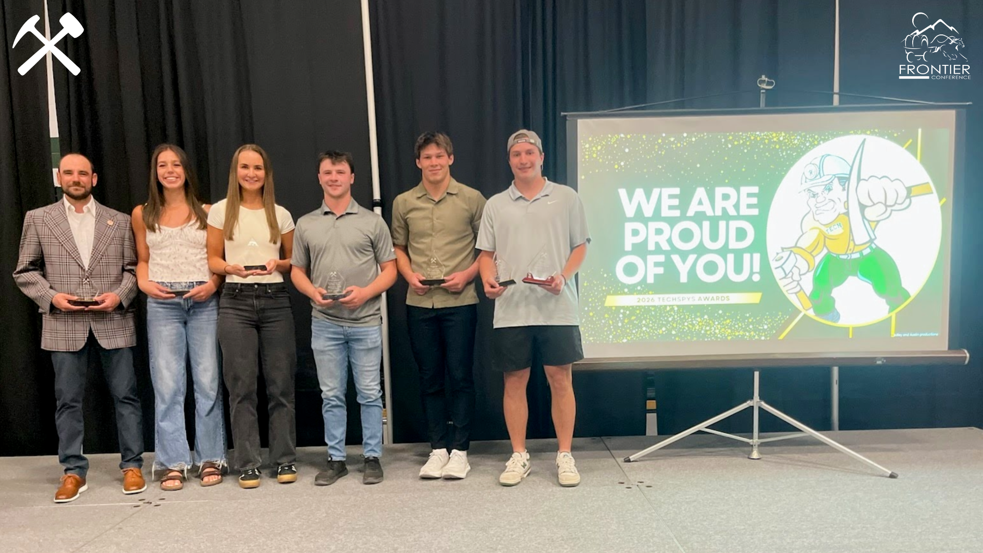 Montana Tech's 2025-26 Techspy Award winners pose on the stage after the program