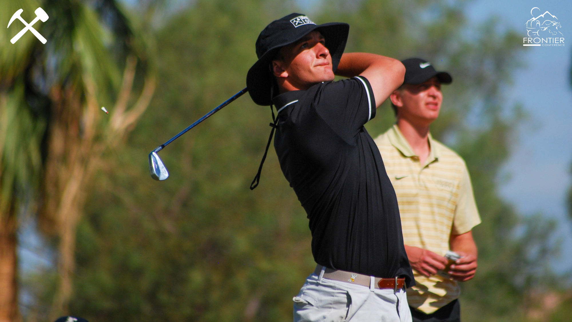 Joe Opitz follows through on a golf shot during a tournament