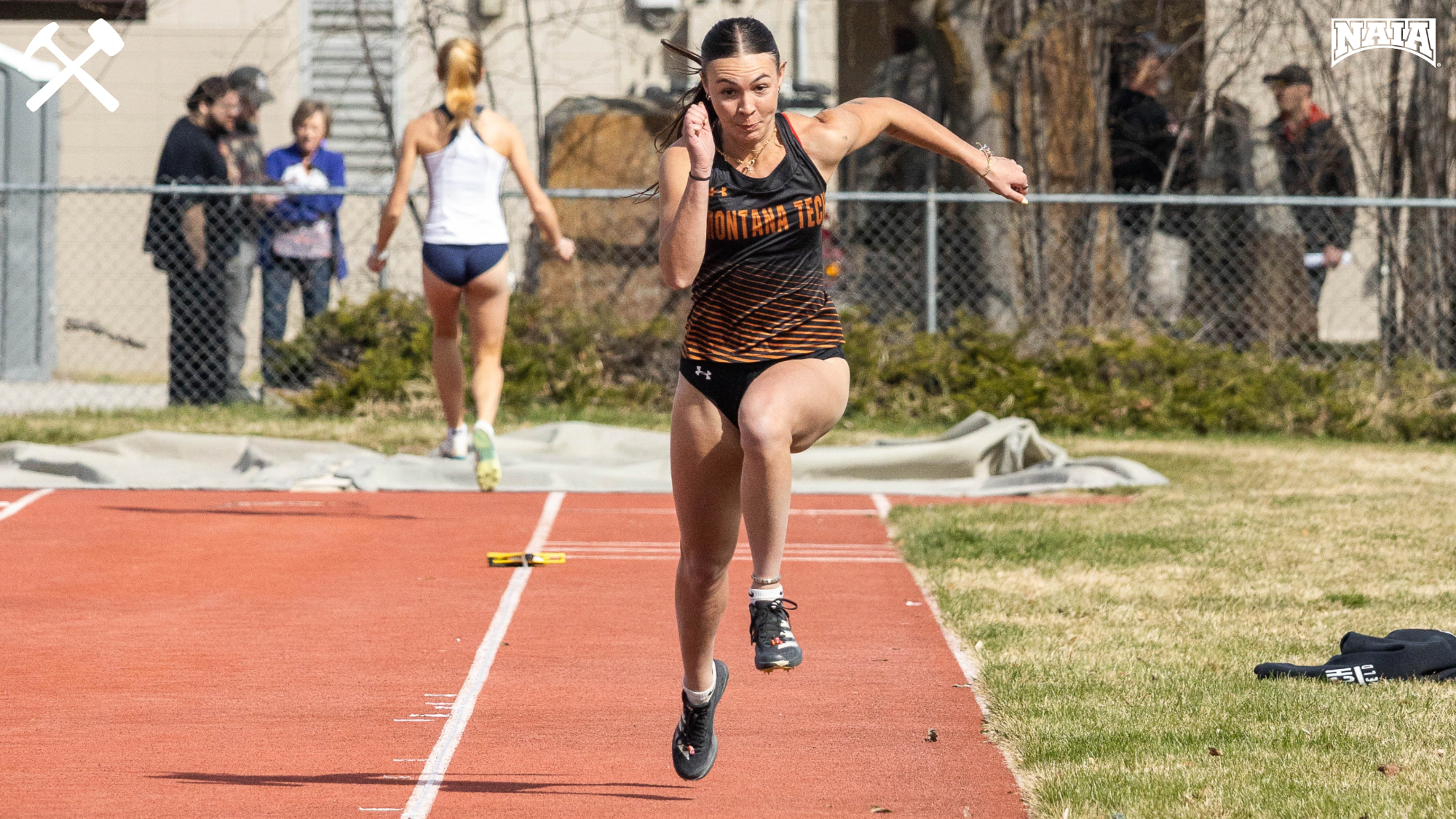 Jadyn Vermillion runs her approach for the long jump at a Montana Tech track meet