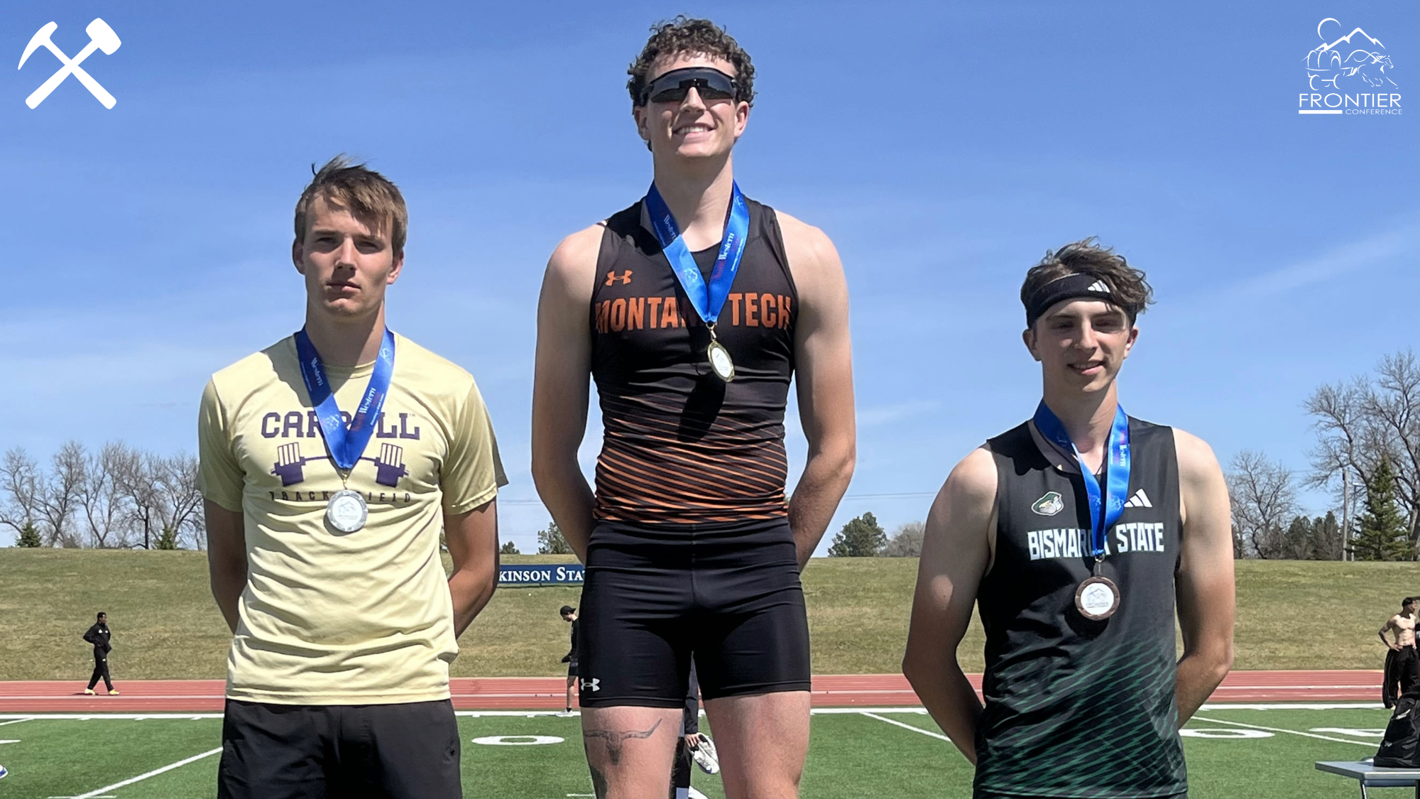 Morgan McClernan stands atop the Frontier Conference podium after winning the 110-meter hurdles at outdoor championships