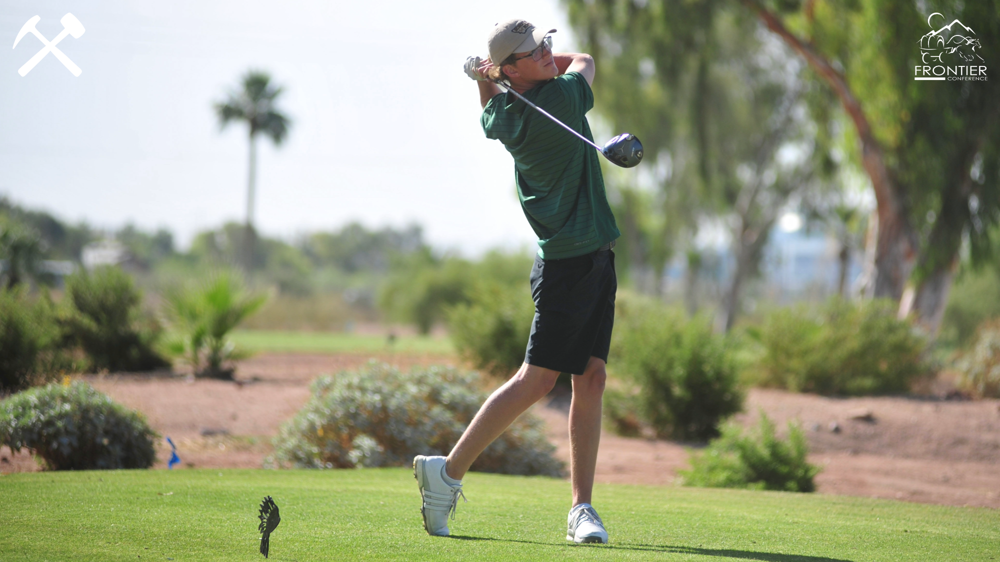 Carson Hupka follows through on a golf shot